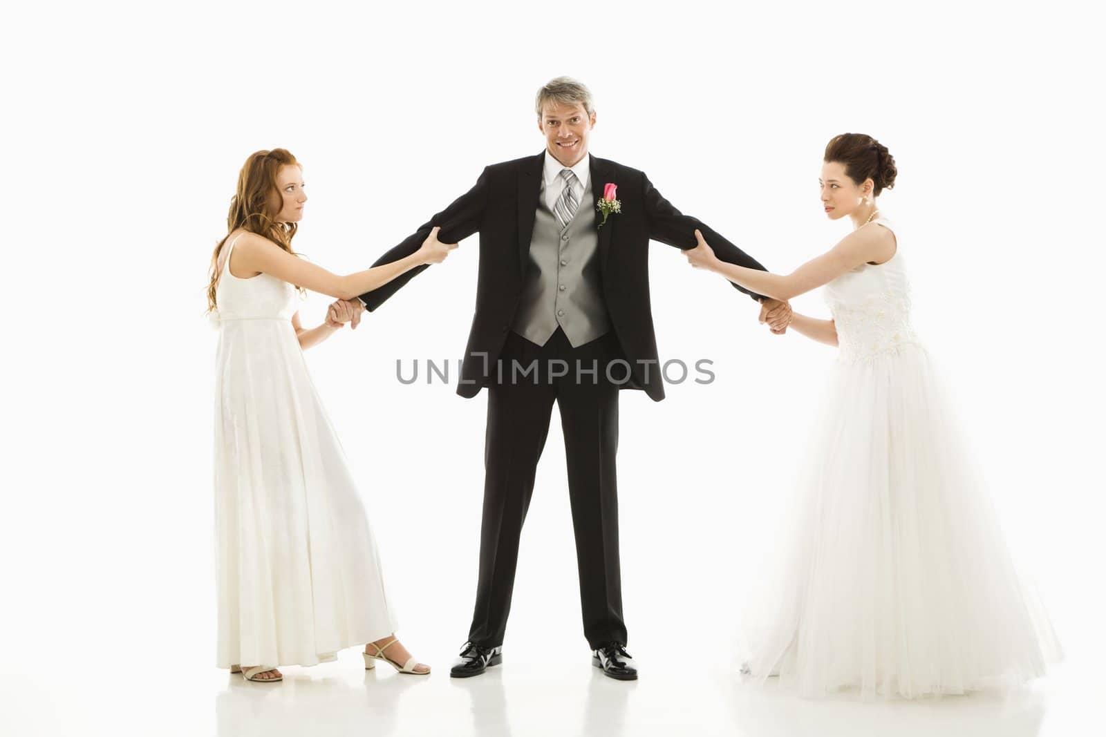 Brides fighting over groom. by iofoto