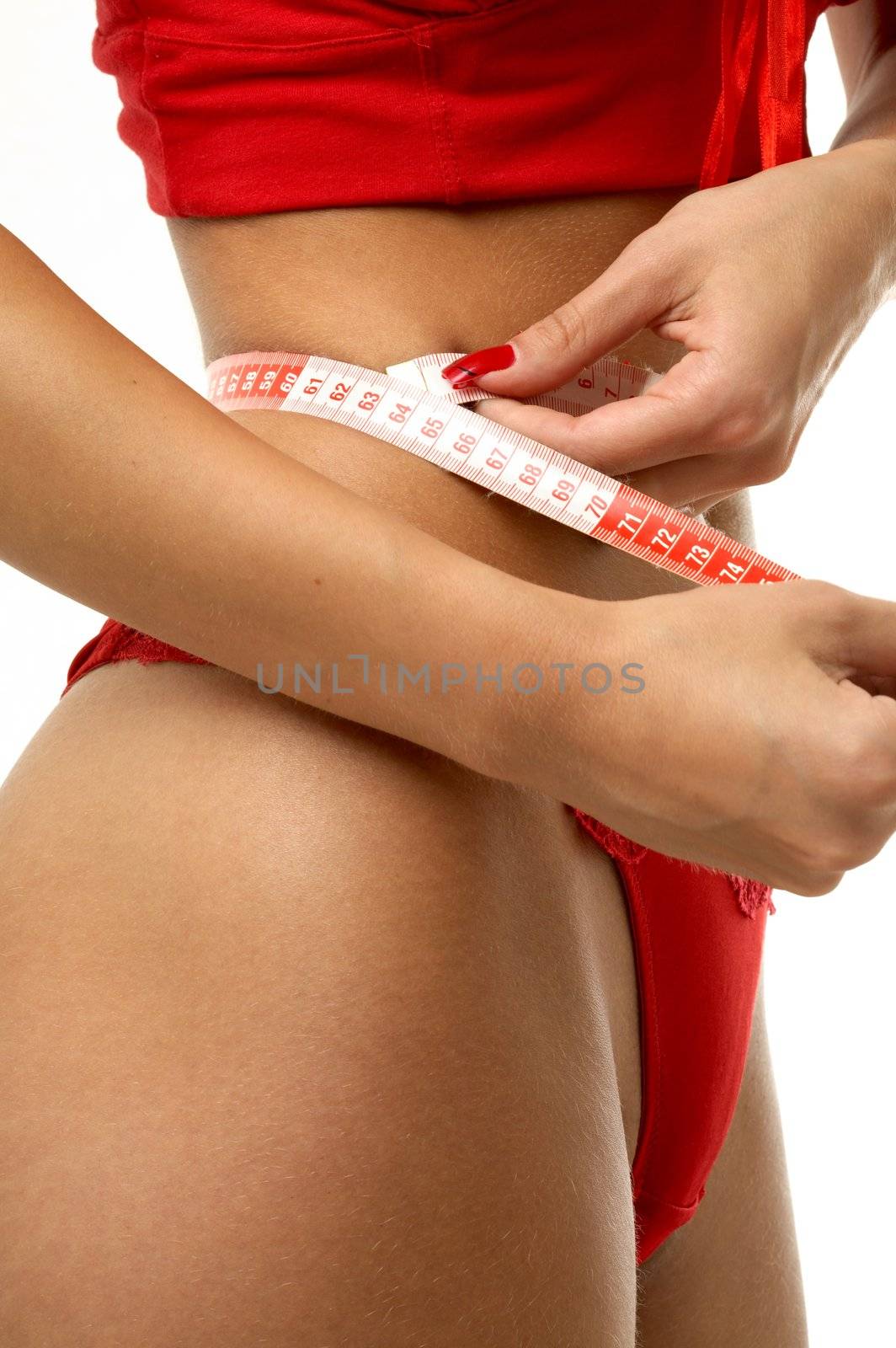 fit girl in red underwear measuring waist