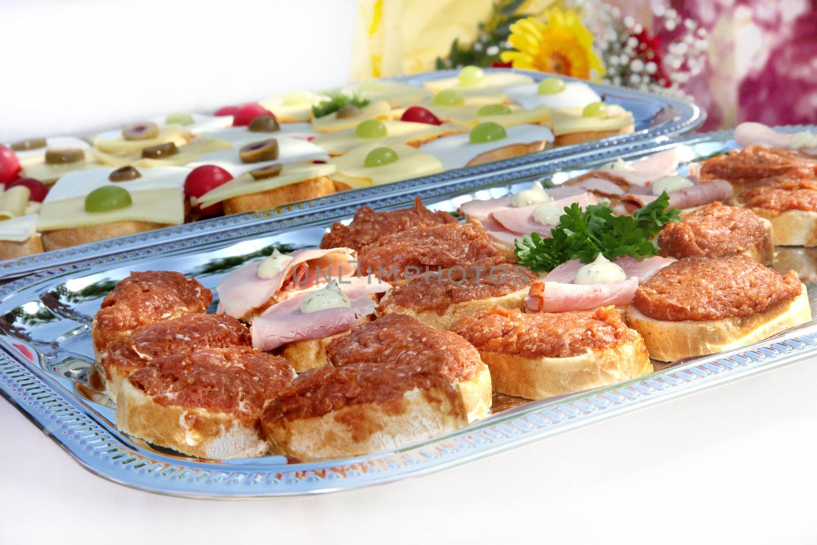 Starter or appetizer - white bread with minced pork or minced meat and cheese
