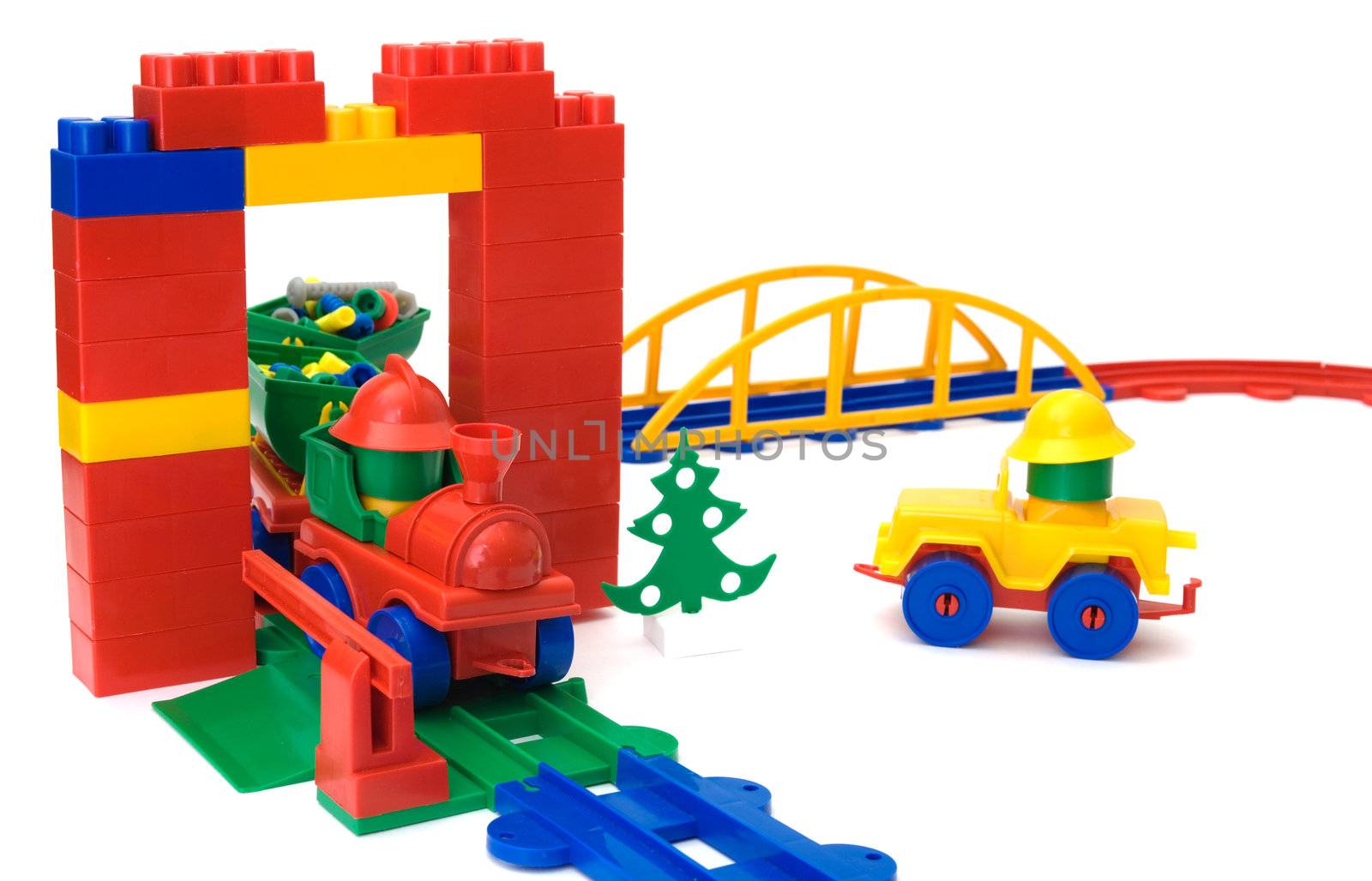 Toy plastic railway and yellow toy machine