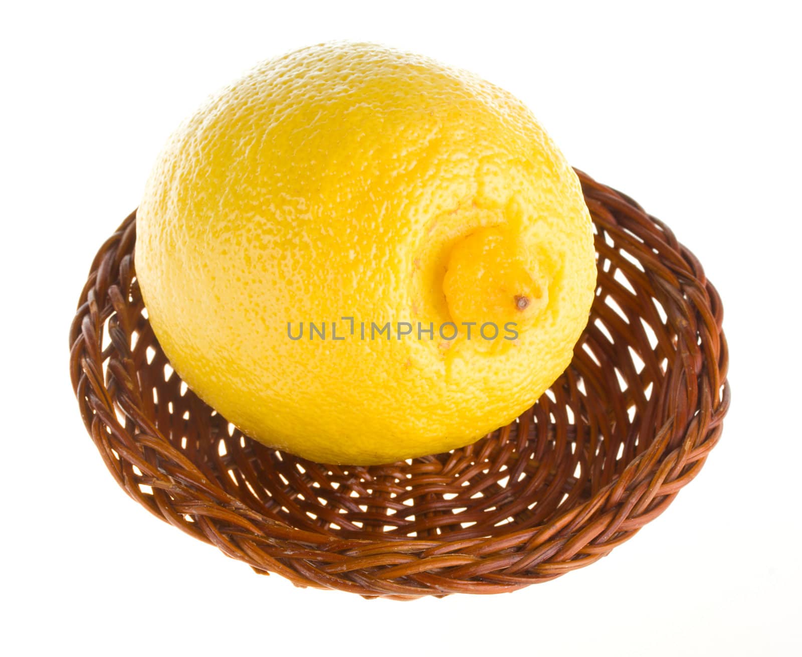 close-up lemon in basket, isolated on white