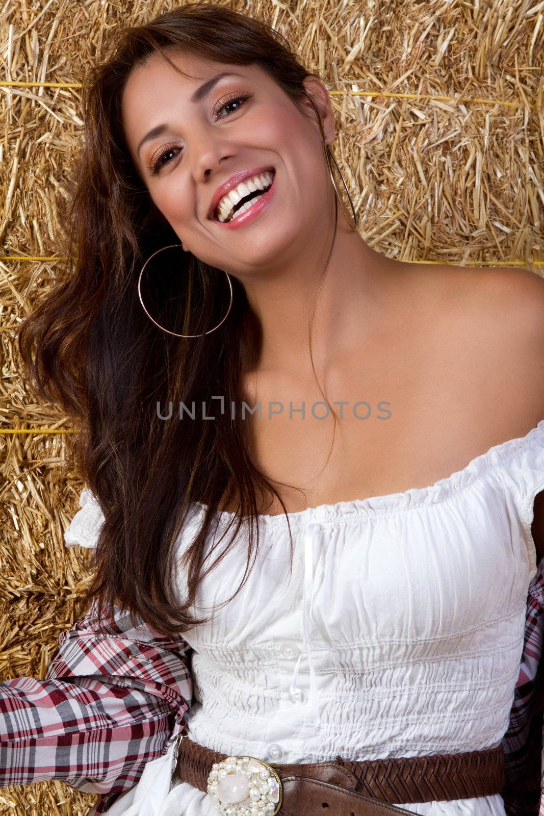 Mexican country girl in hay