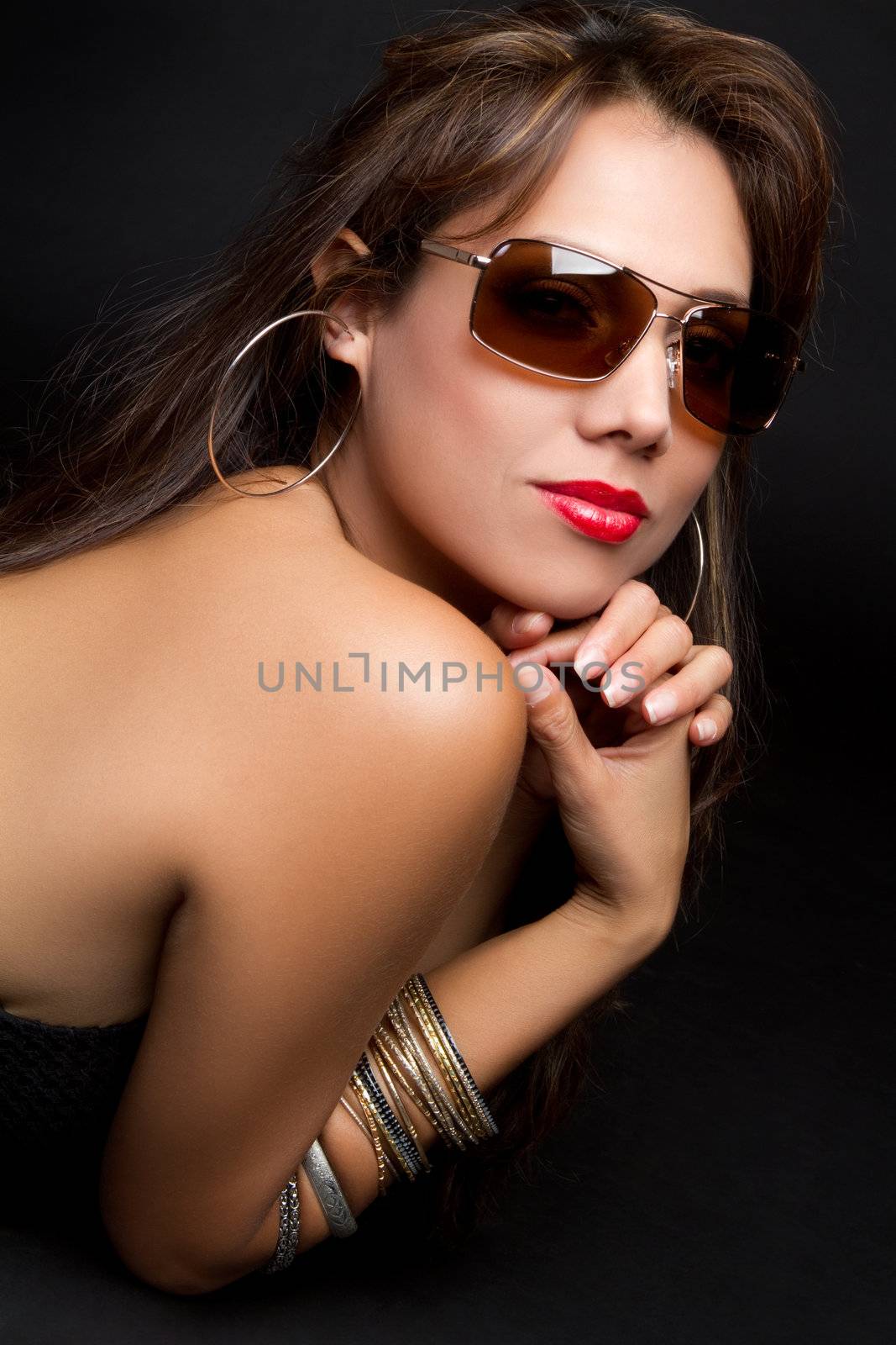 Beautiful latina woman wearing sunglasses