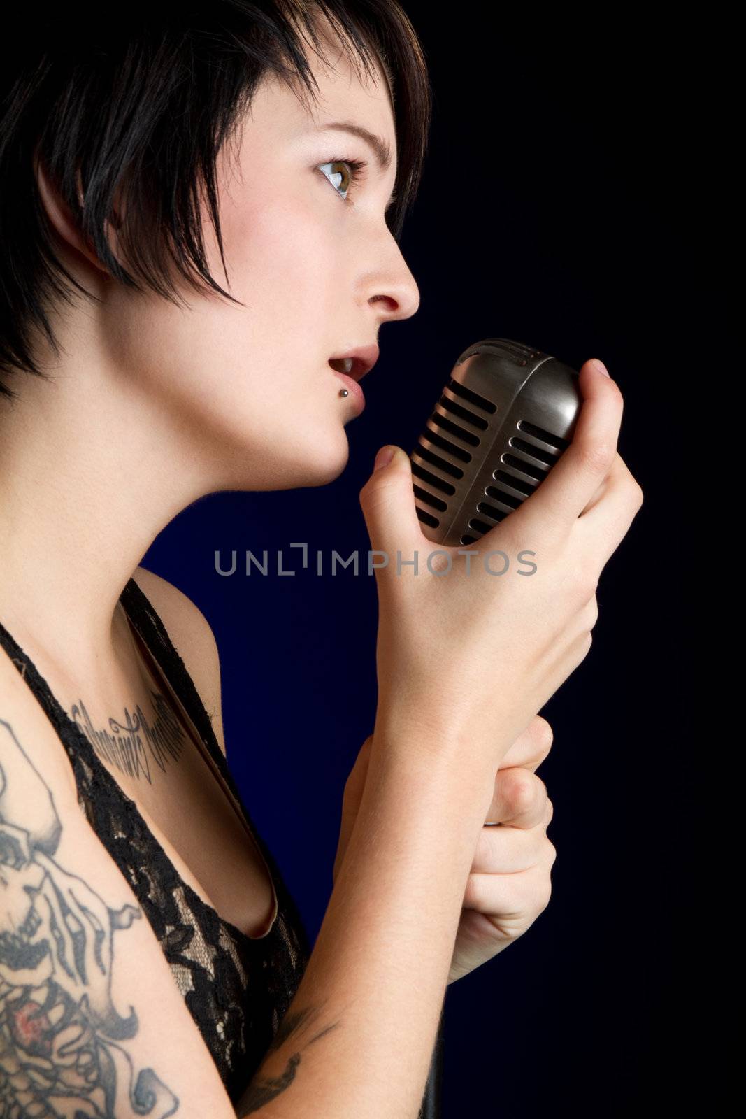 Pretty girl singing into microphone