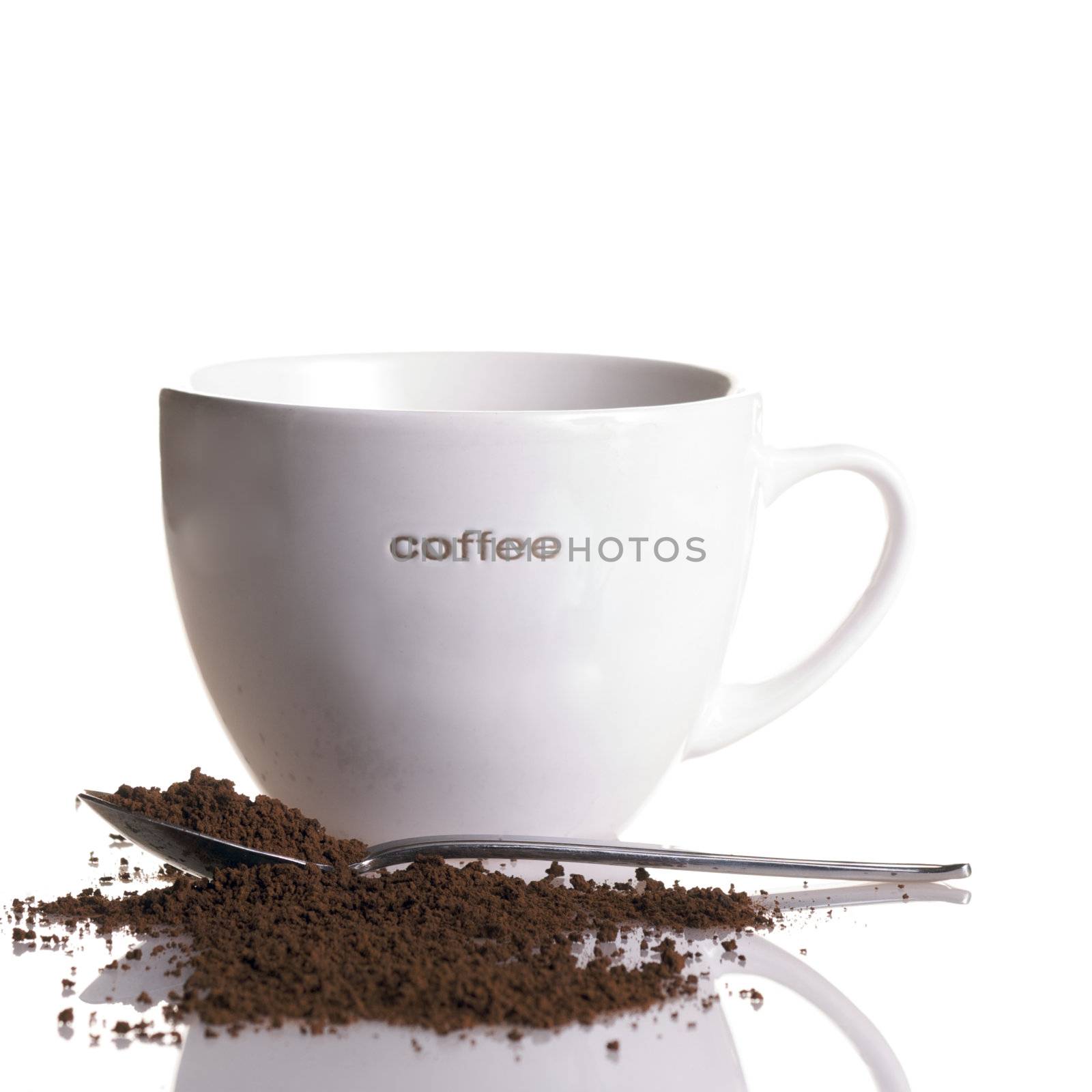White Coffee Mug with Spoon and Spilled Instant Coffee isolated on White in Square Format.