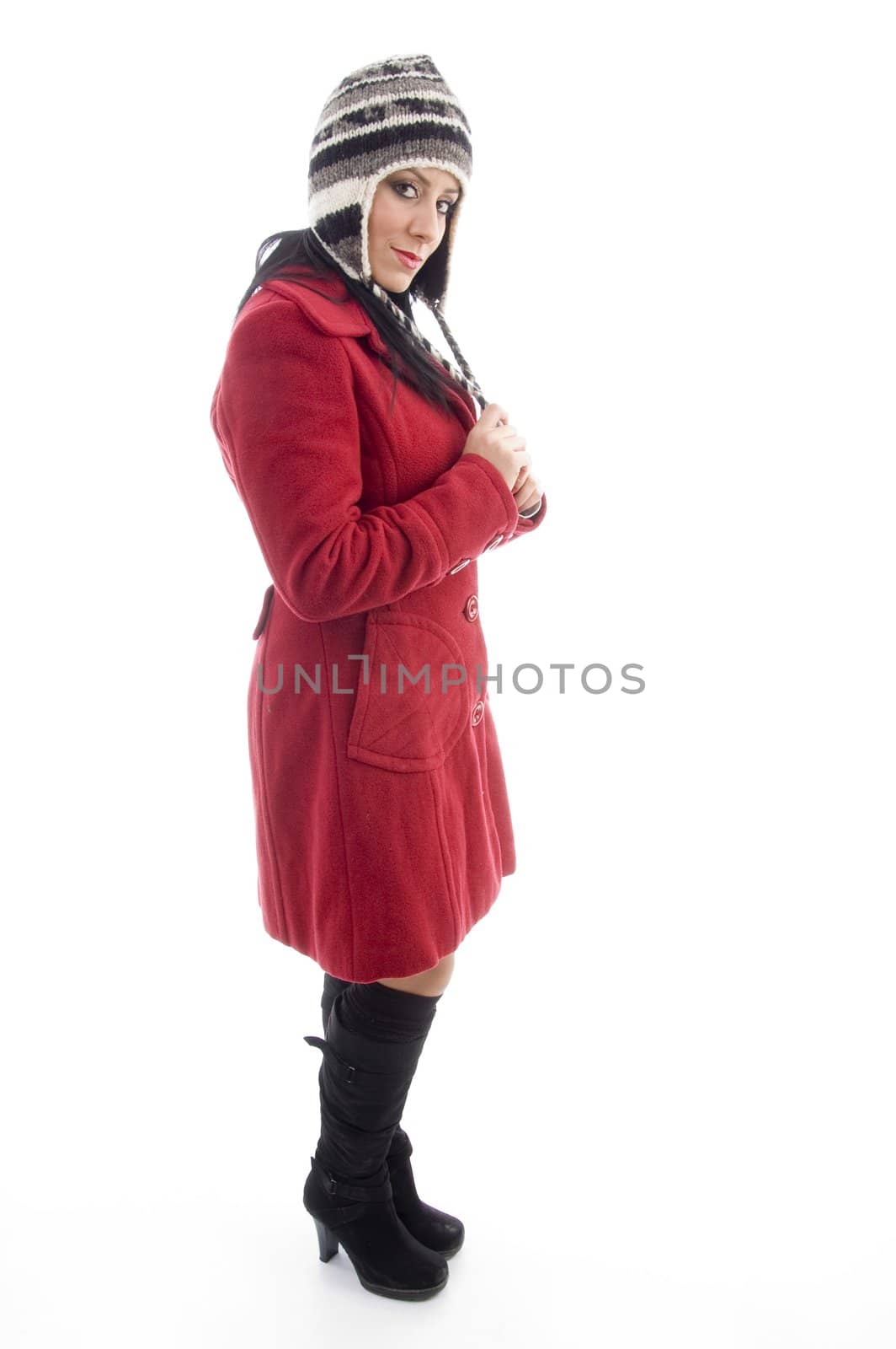 young female in winter clothes on an isolated white background