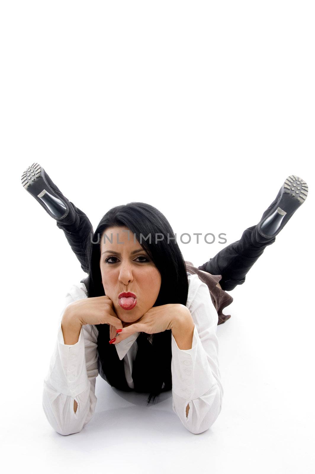 young woman lying down on floor and teasing on an isolated white background