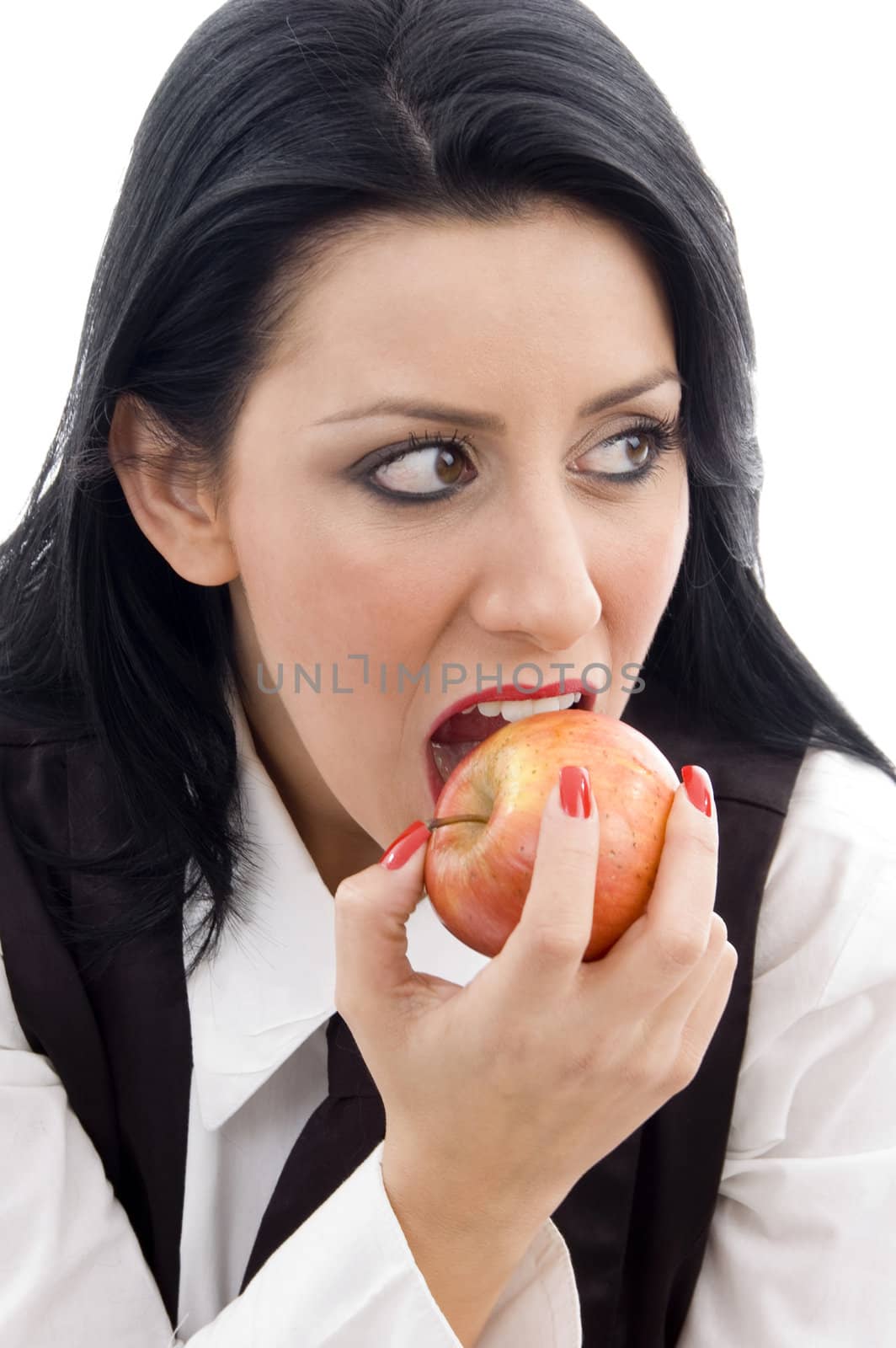 american woman eating an apple on an isolated background