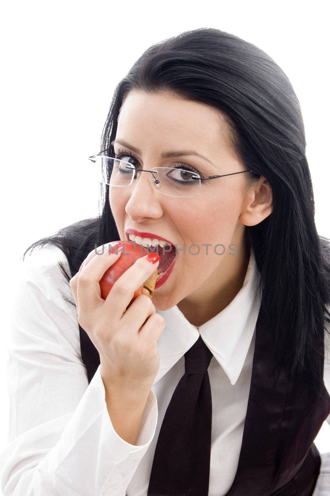 caucasian model wearing spectacles eating an apple against white background