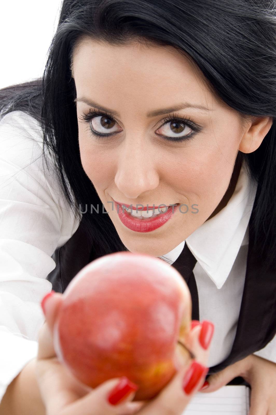 young student holding an apple on an isolated white background