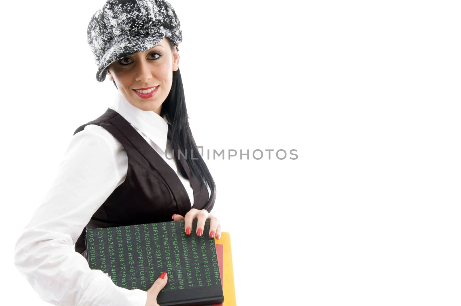 female student wearing cap holding books   by imagerymajestic