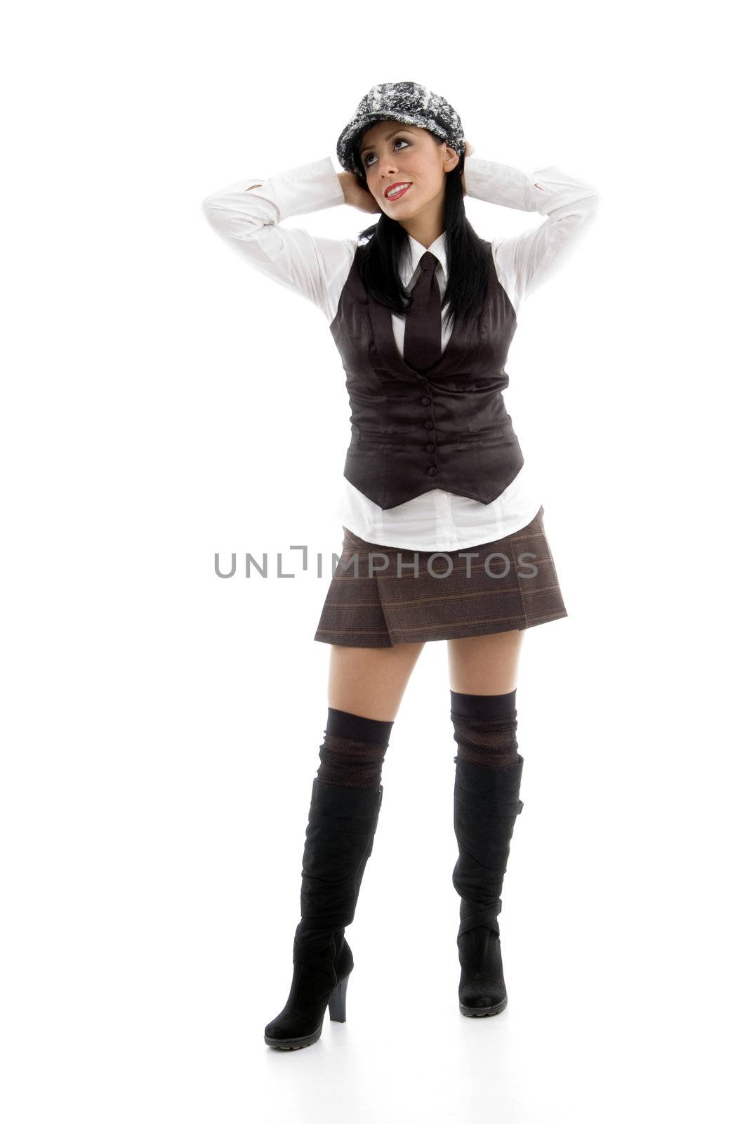 full body pose of caucasian model looking sideways against white background