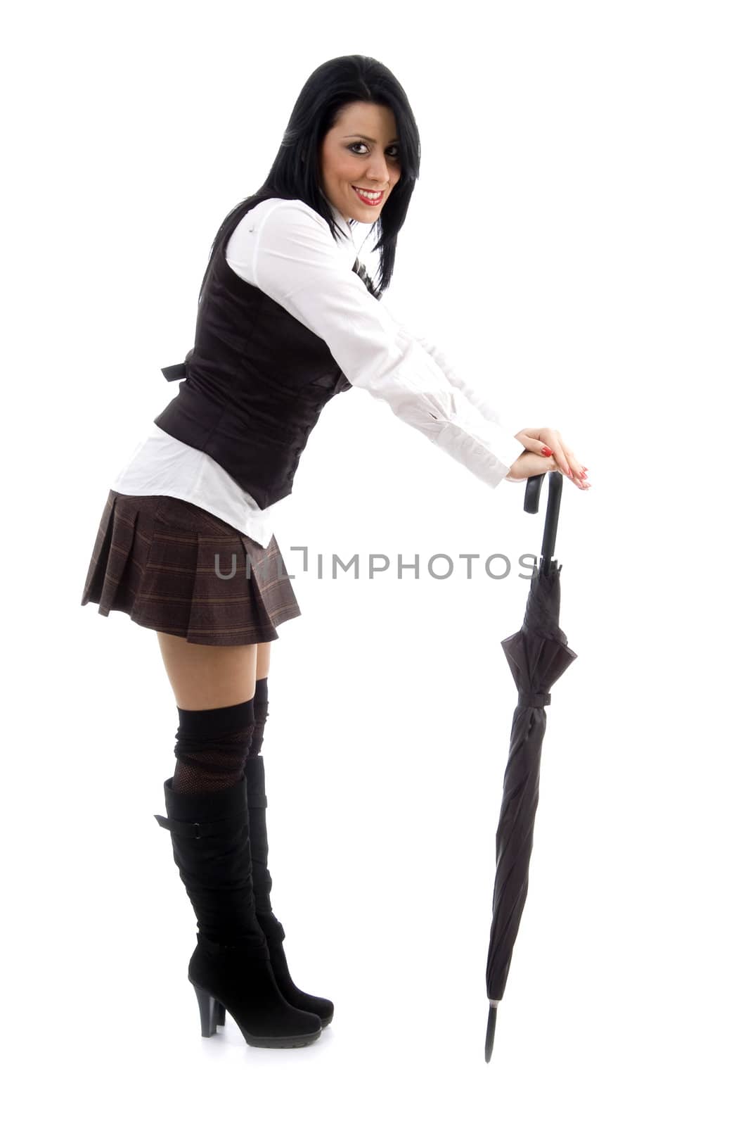 caucasian female posing holding an umbrella on an isolated background