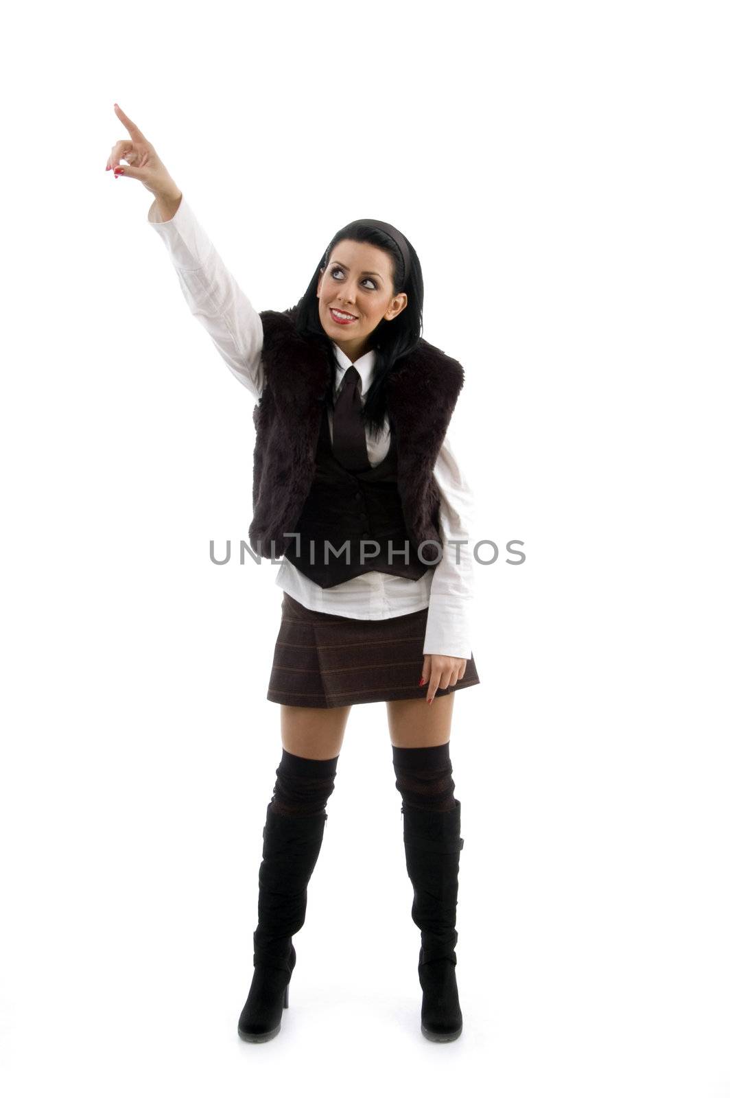 young woman pointing sideways on an isolated white background