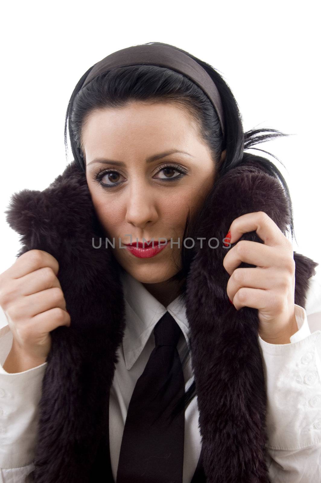 young woman in fur jacket against white background