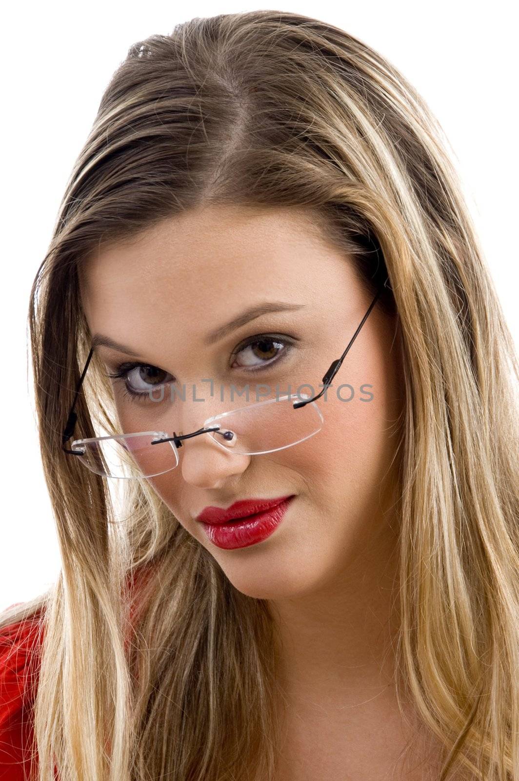 gorgeous woman posing in red and wearing eyeglasses on an isolated white background