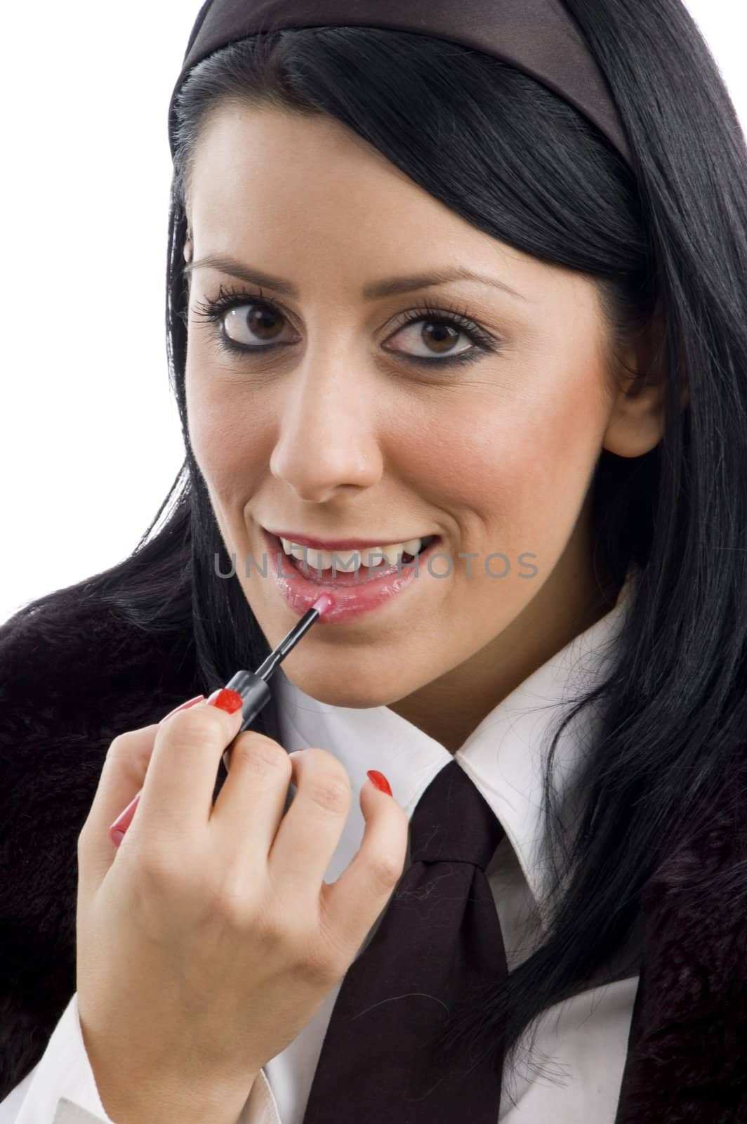 fashionable woman applying lipstick on an isolated white background