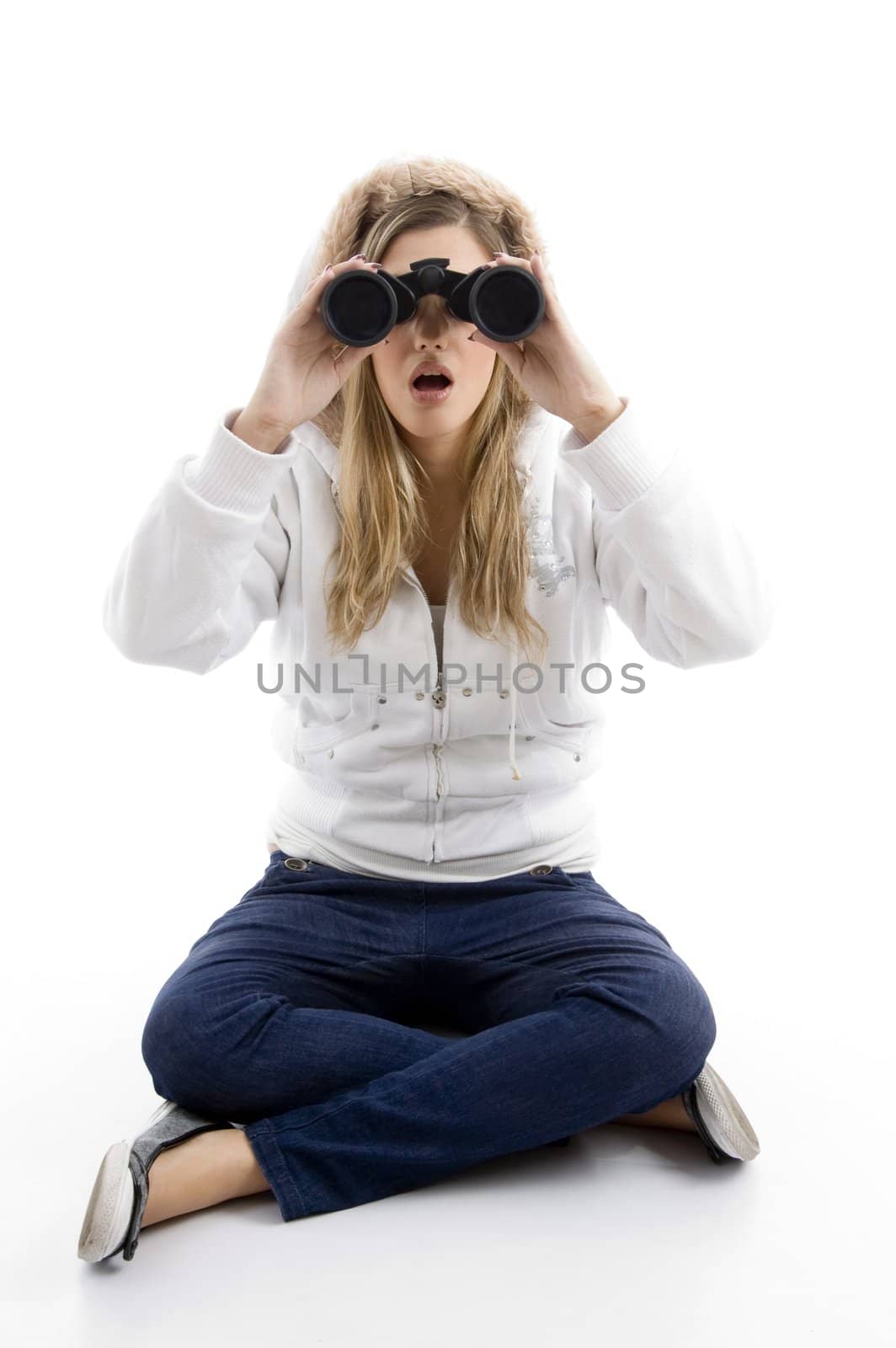 young female watching into binoculars against white background