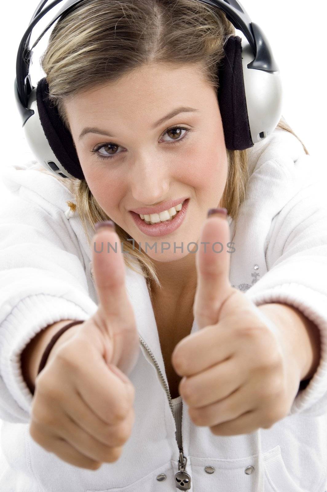 young model listening music with headphones and showing thumbs u by imagerymajestic