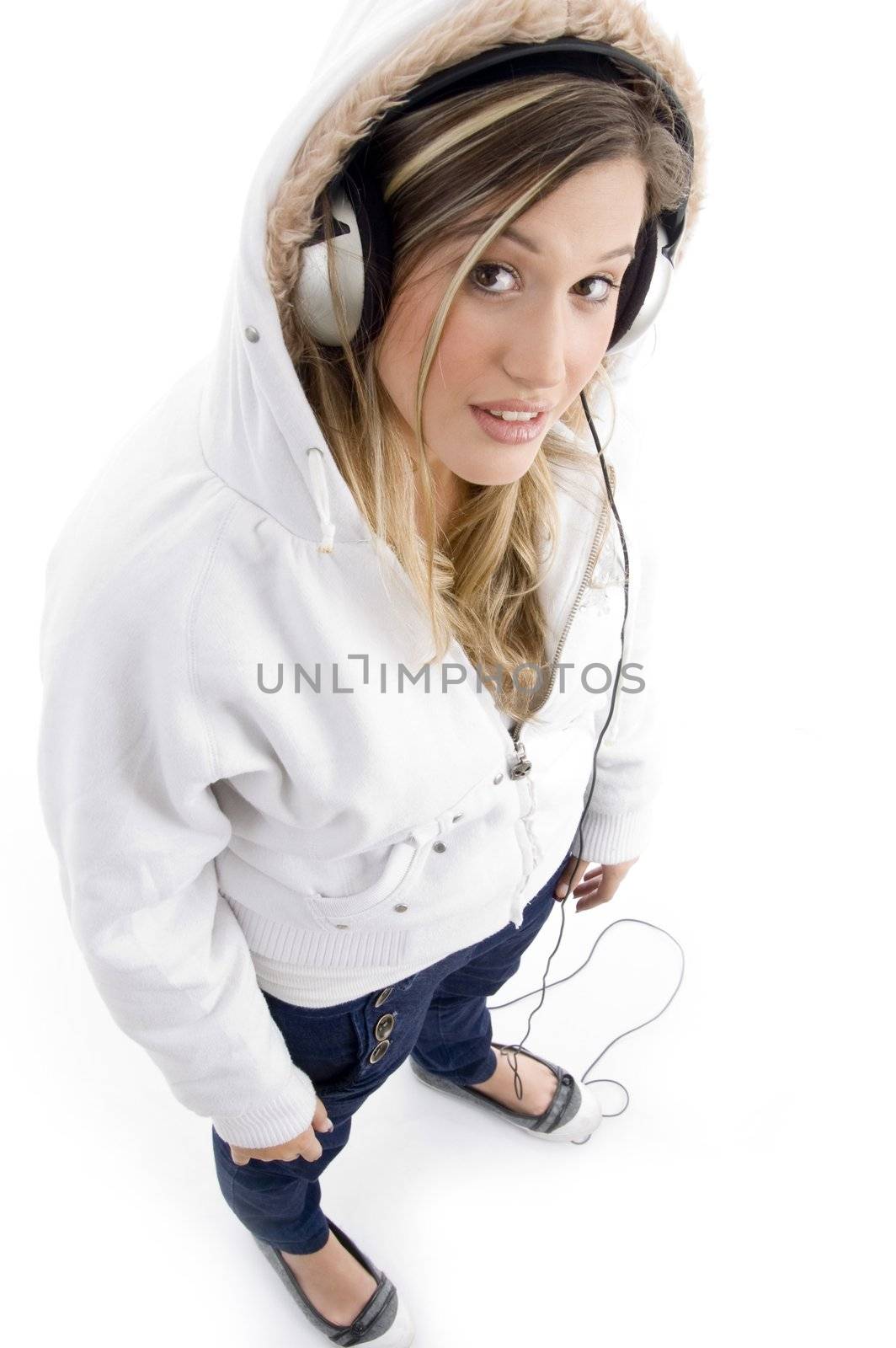 young model listening music with headphones by imagerymajestic