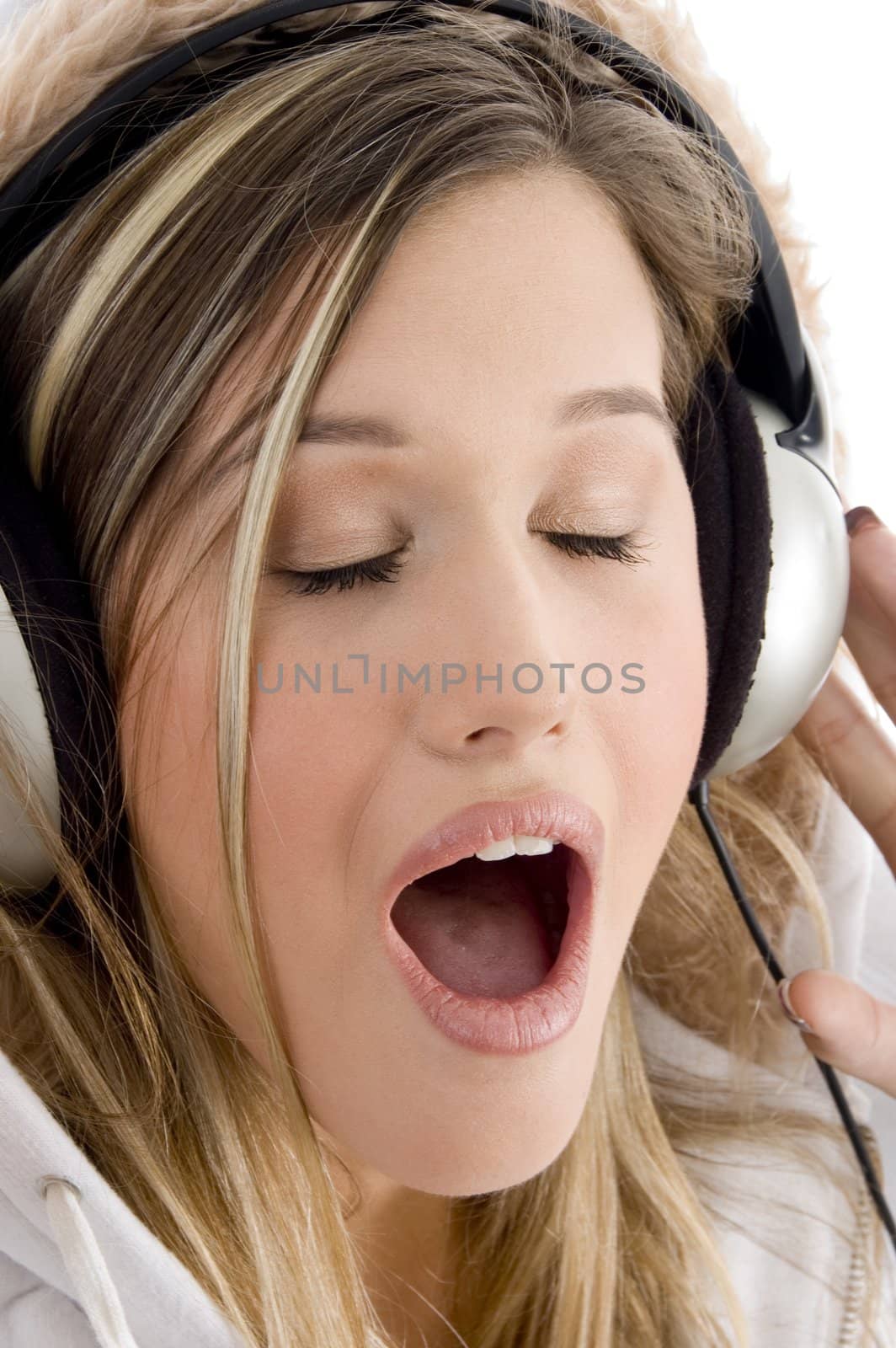 woman listening to music with closed eyes by imagerymajestic