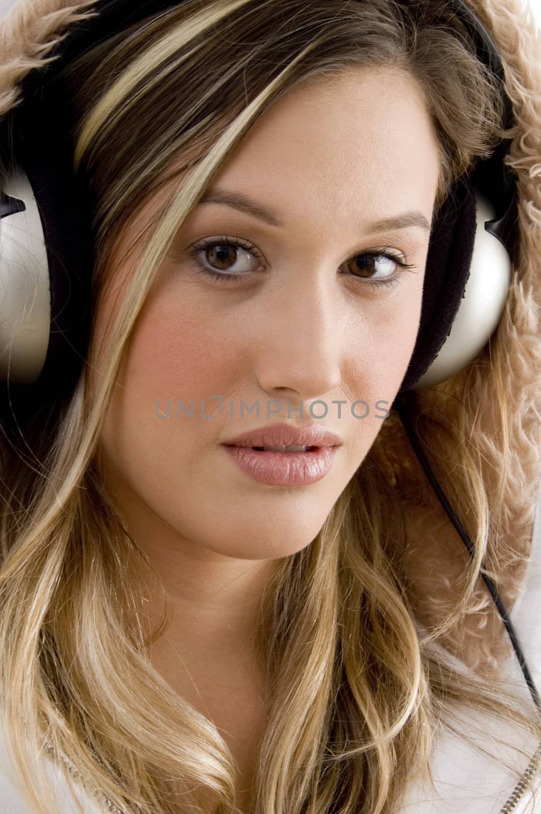 young woman enjoying music with headphones by imagerymajestic