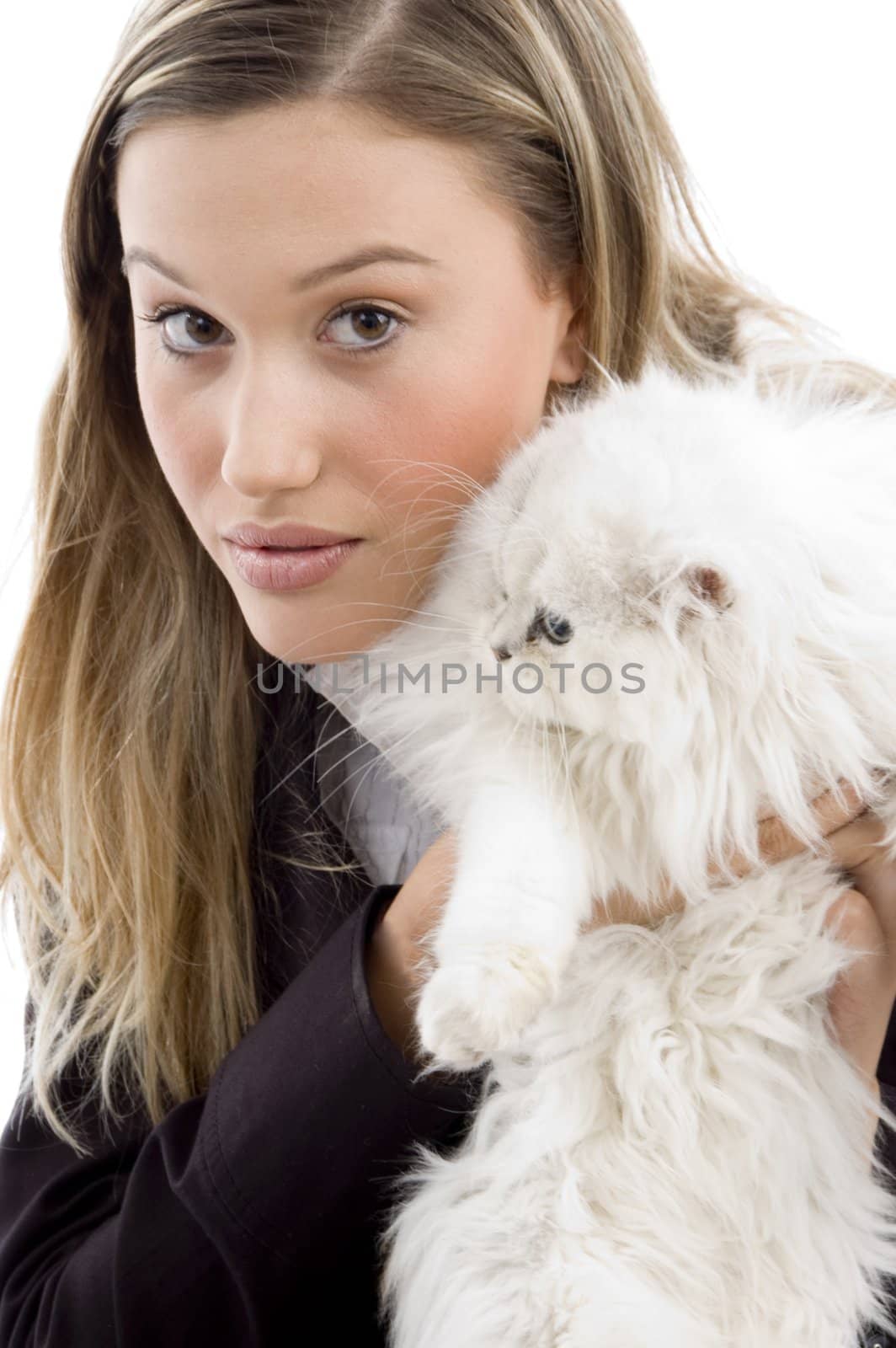 young model posing with her kitten against white background