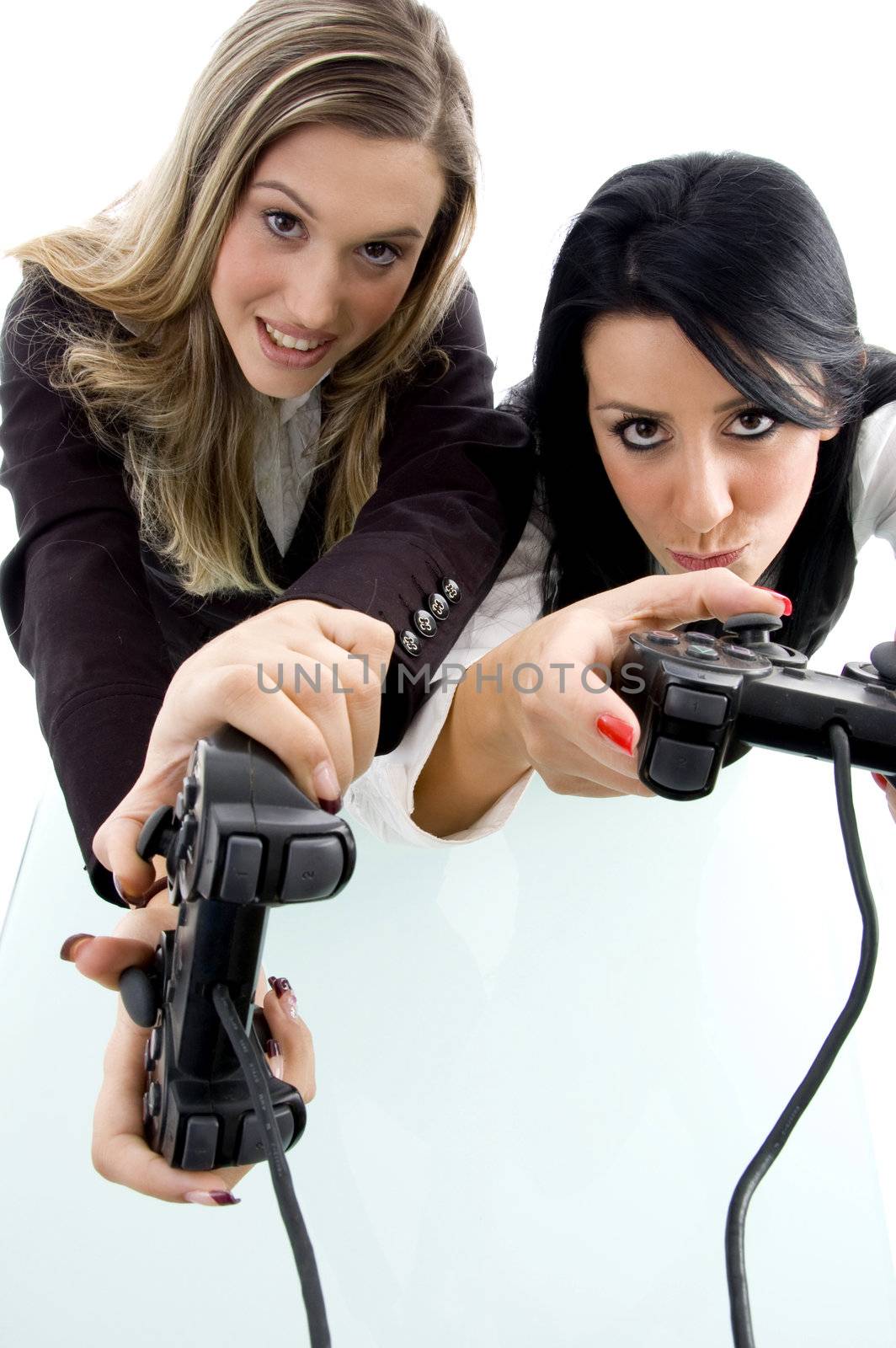 partners playing game and holding remote by imagerymajestic