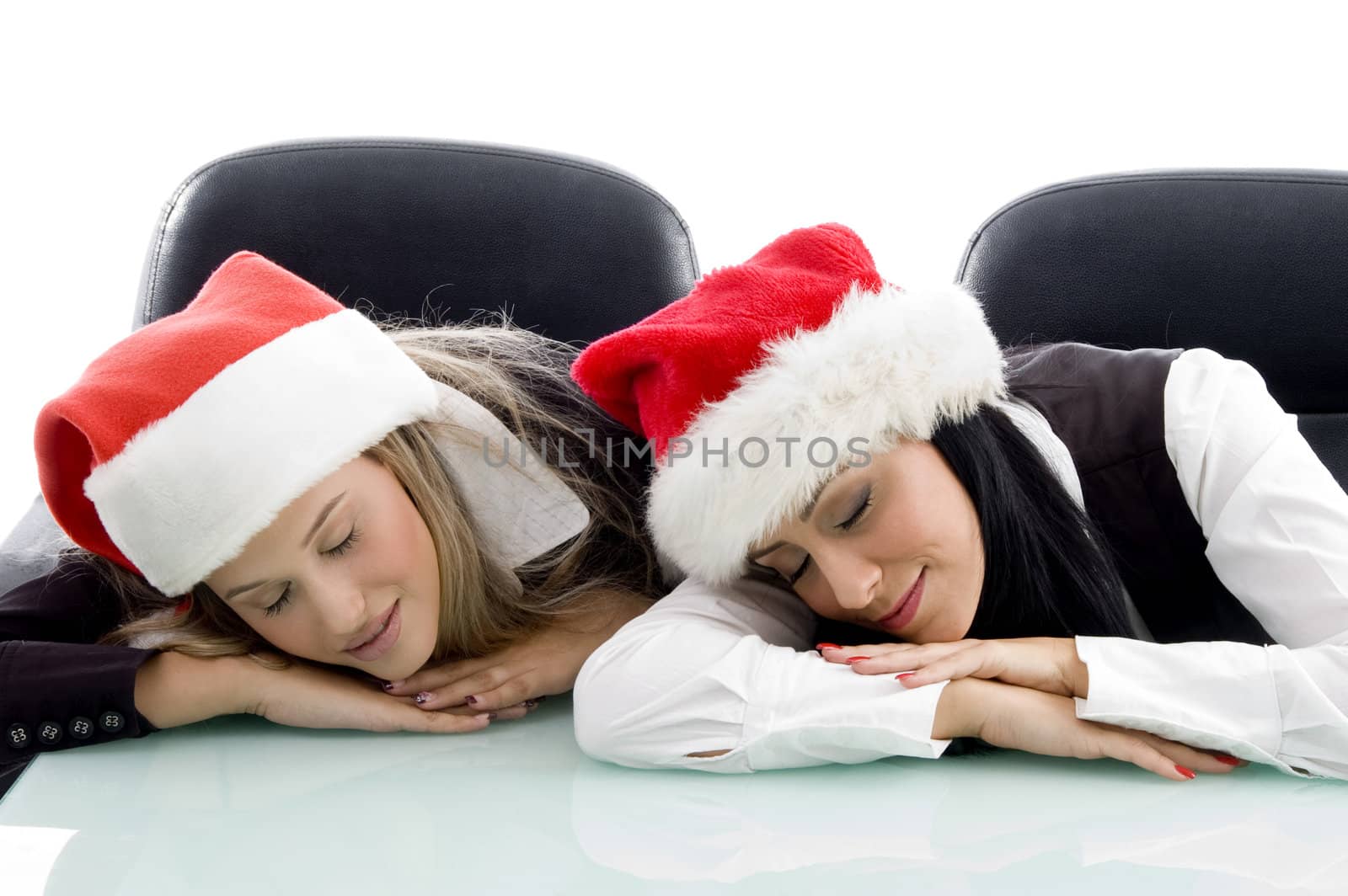 young corporate wearing christmas hat and sleeping on an isolated white background