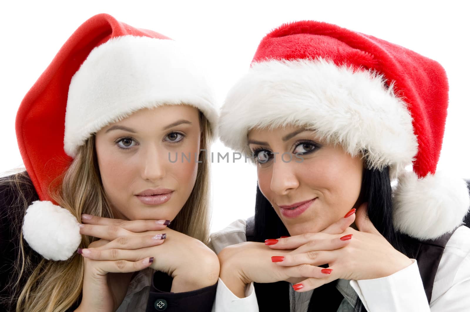 young colleagues wearing christmas hat by imagerymajestic