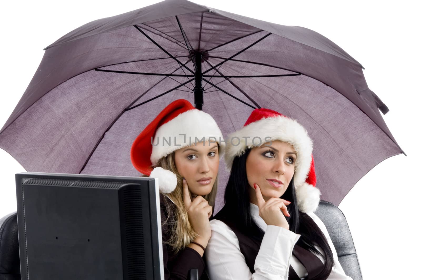 young executives posing together in christmas hat in office