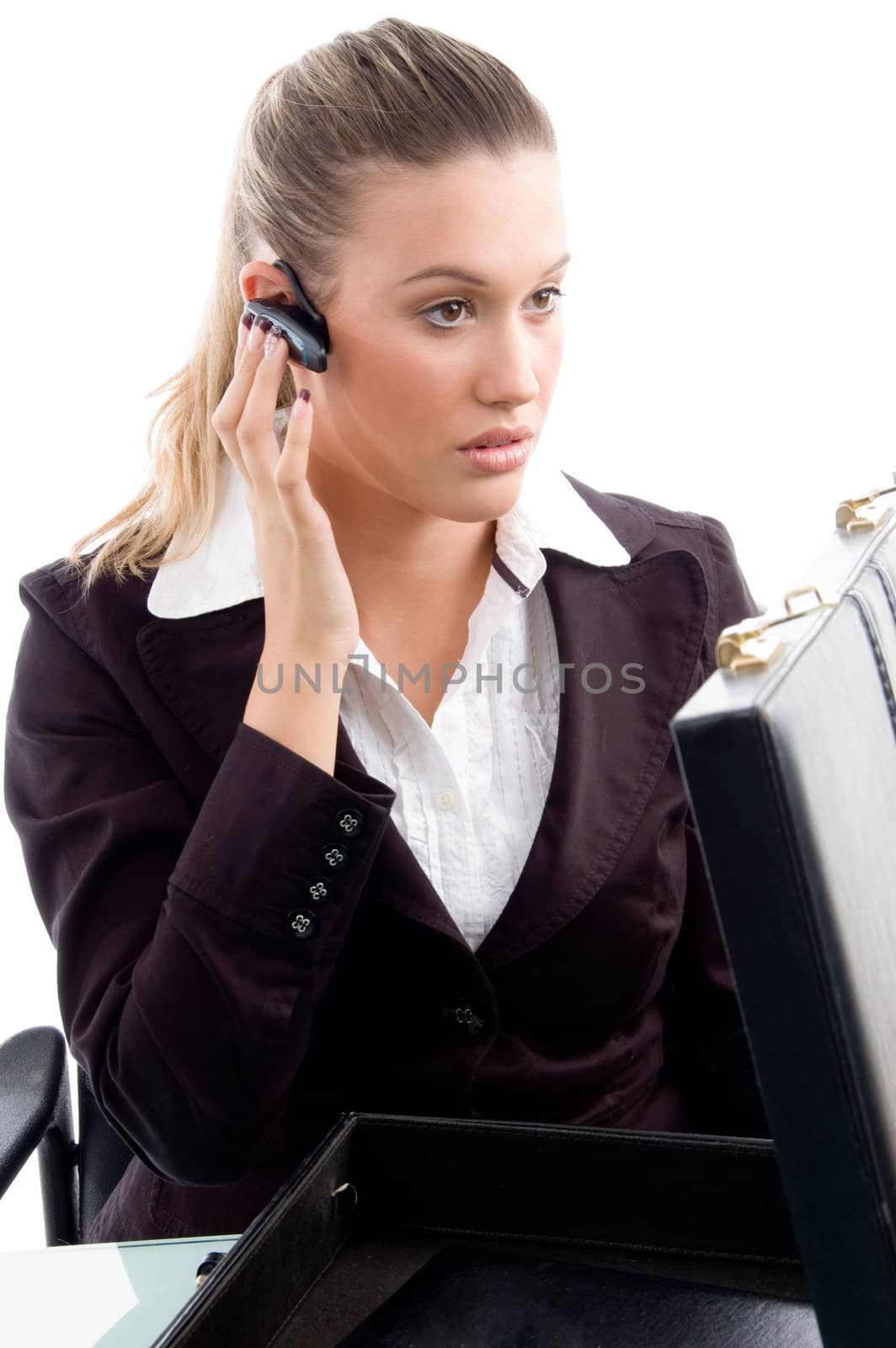 professional woman wearing bluetooth  and looking sideways in office