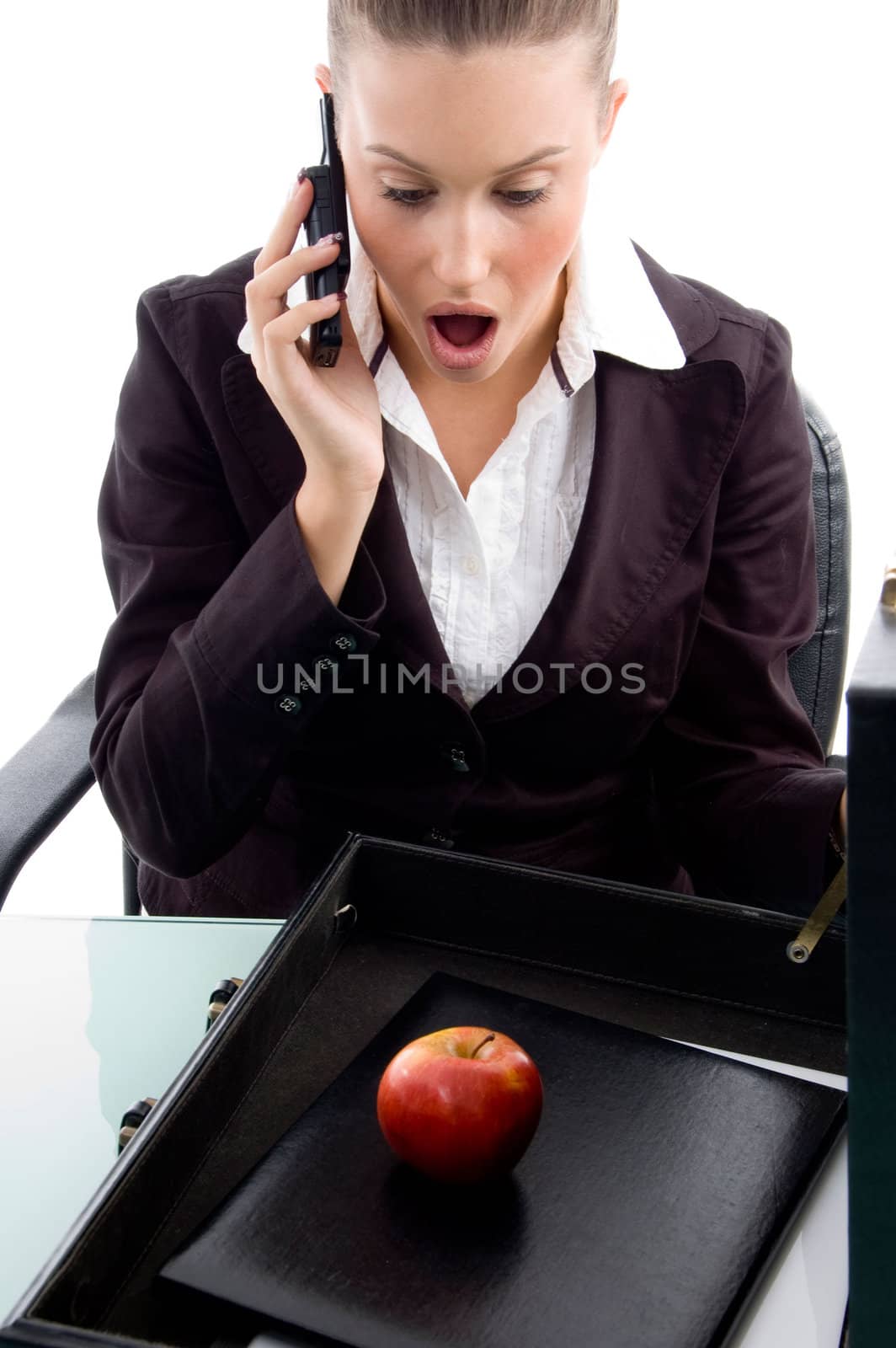 shocked professional talking on mobile on an isolated white background