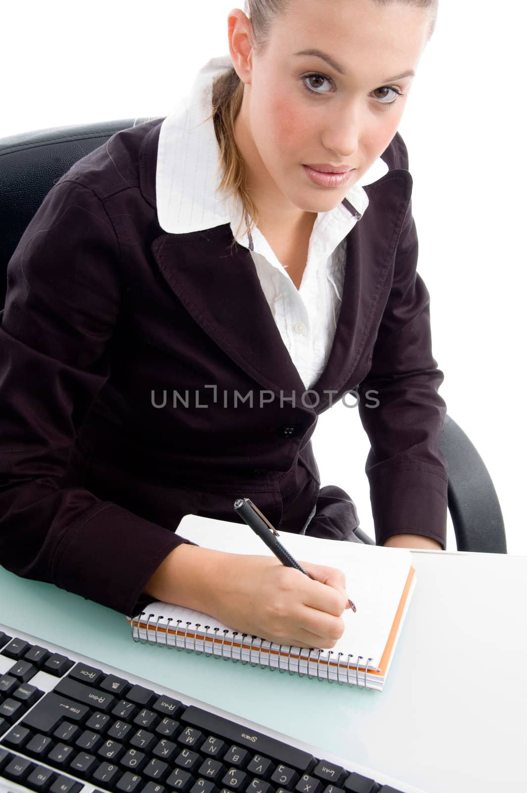 young professional writing on notebook on an isolated background