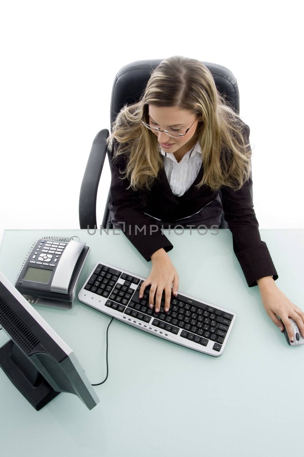 high angle view of woman working on computer by imagerymajestic