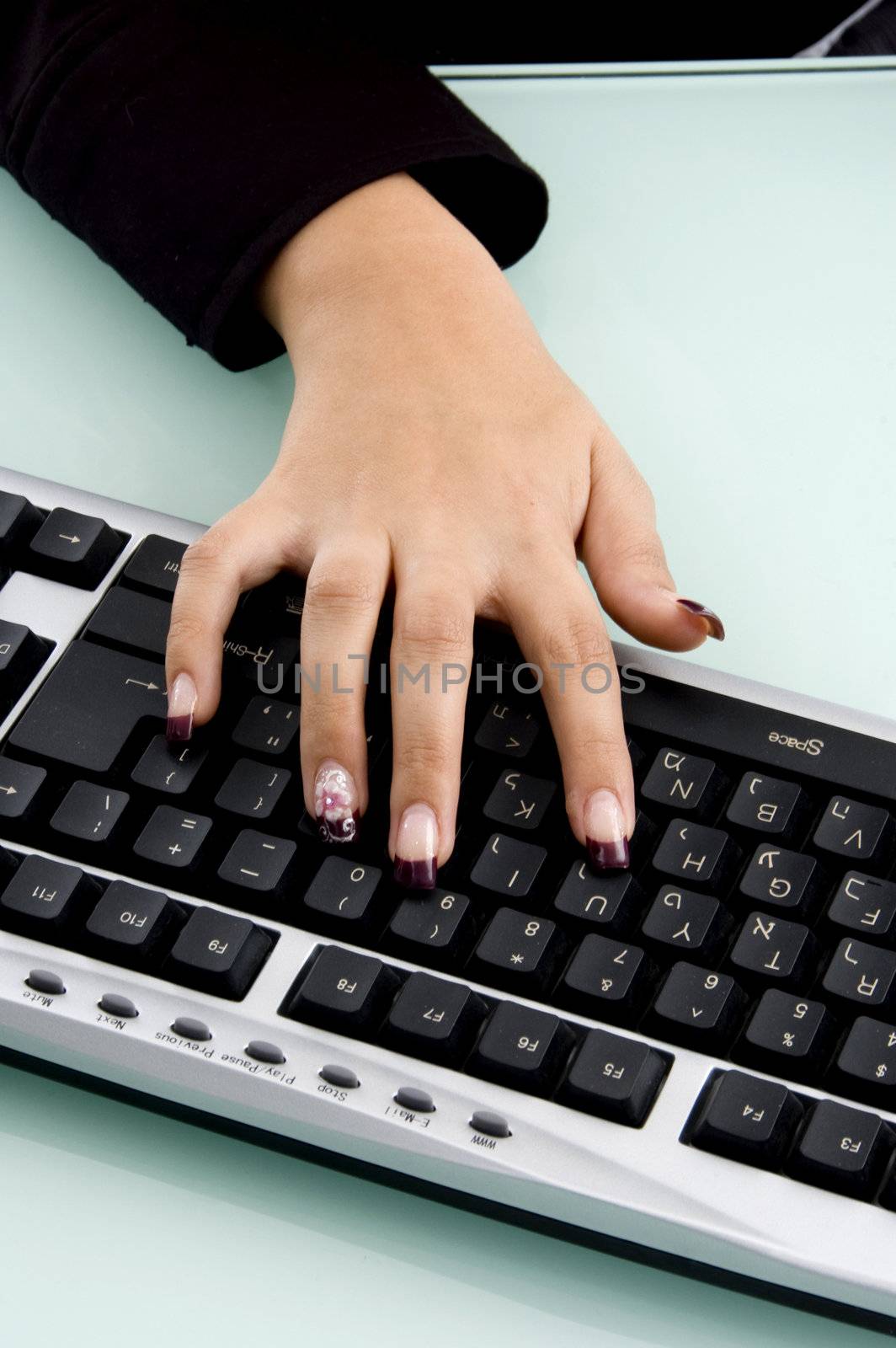 hand on keyboard against white background