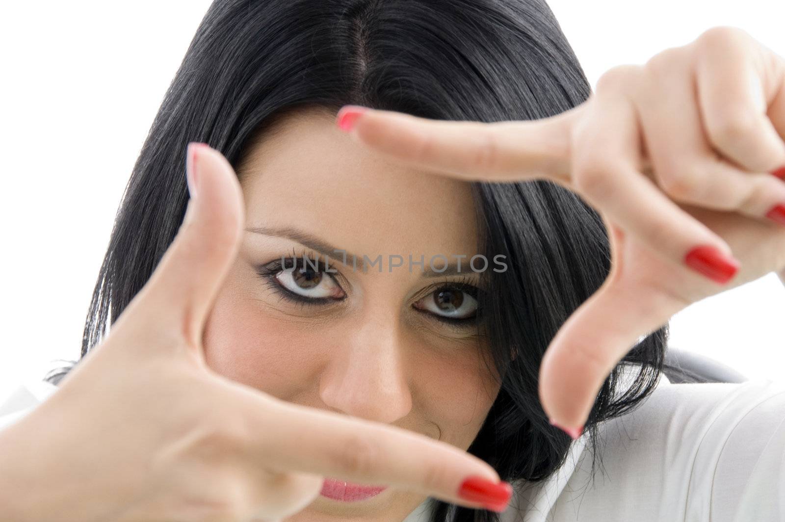 female showing framing hand gesture on an isolated white background