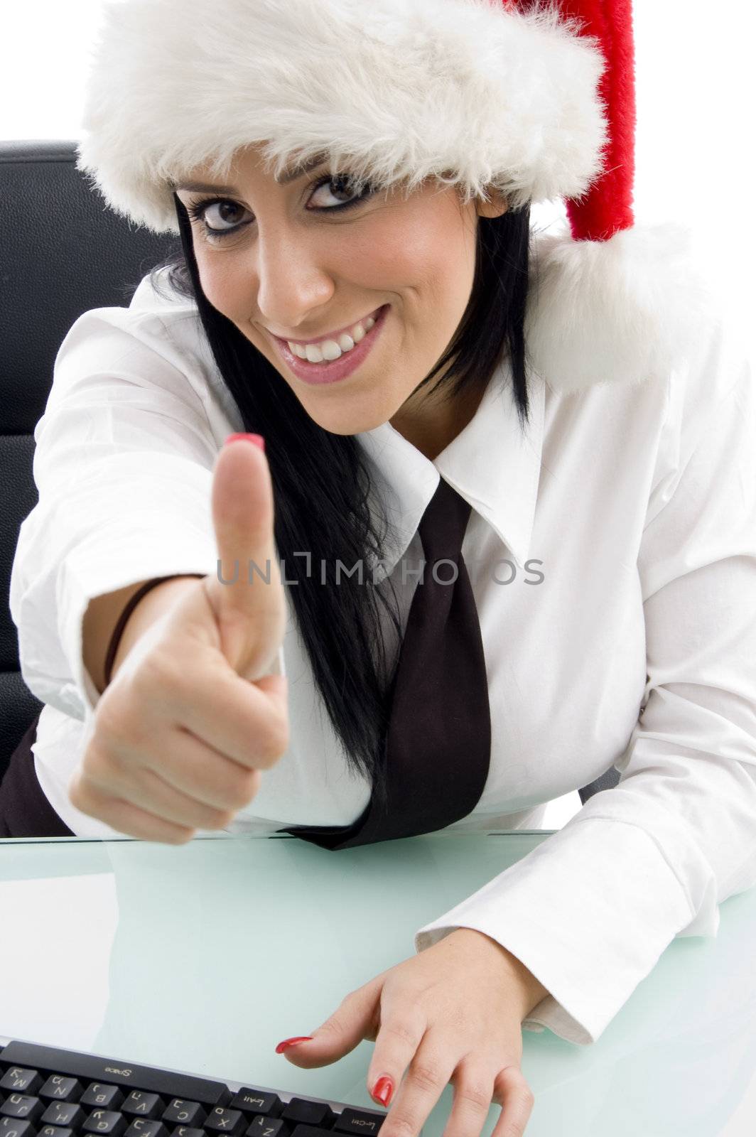 woman with christmas hat and thumbs up on an isolated white background