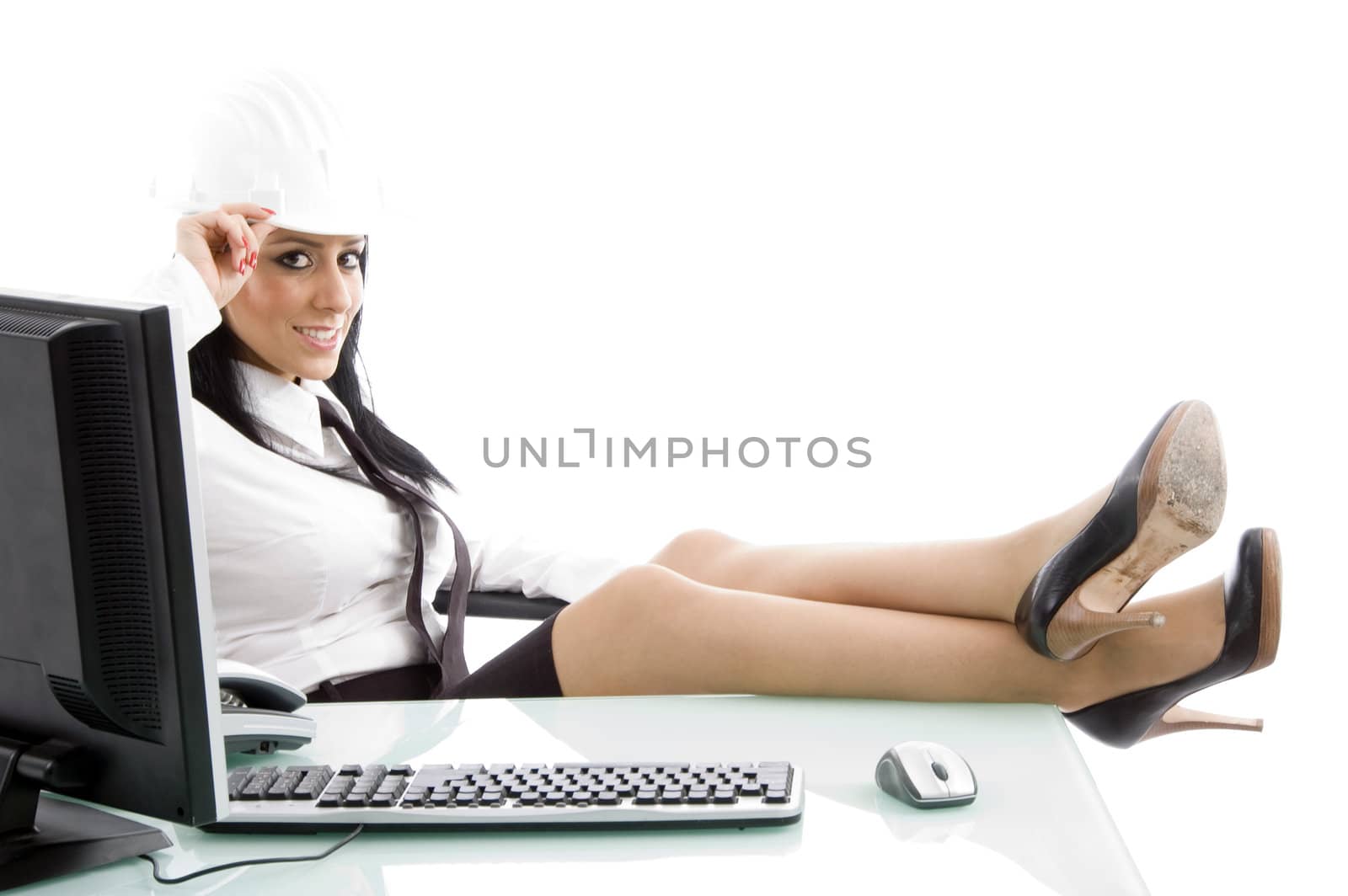 businesswoman posing with architect helmet against white background