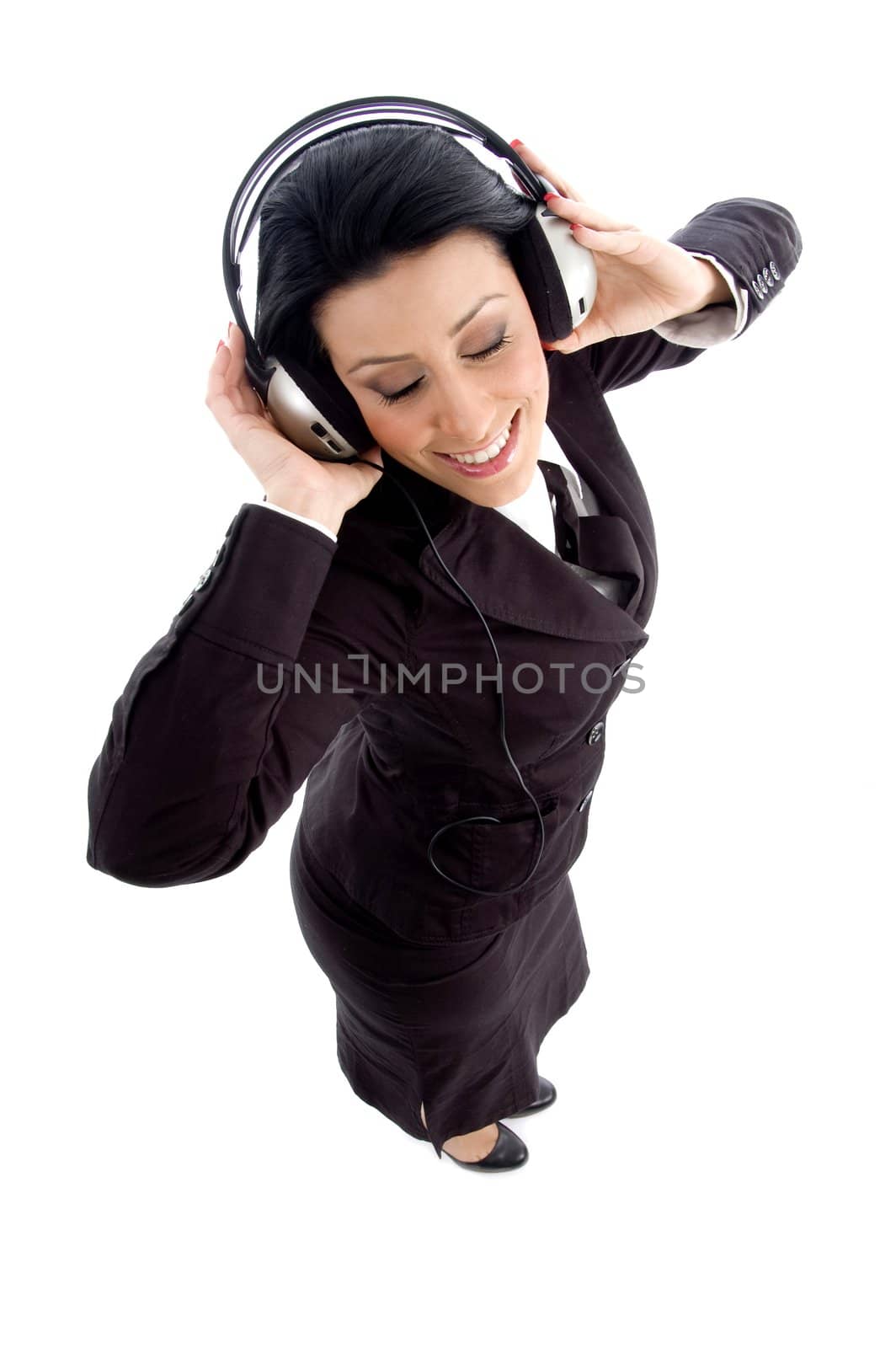 young businesswoman holding headphone by imagerymajestic
