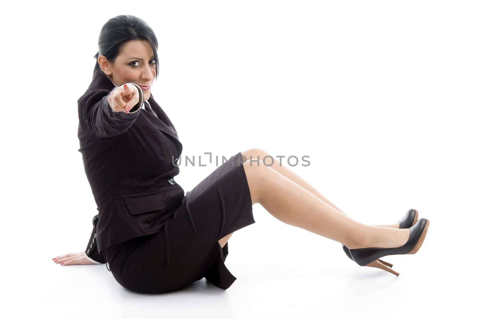 young ceo pointing at camera against white background