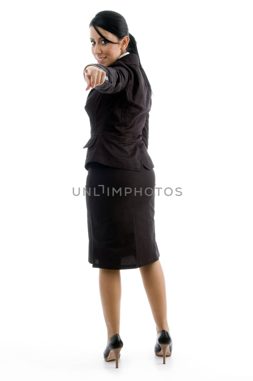 back pose of businesswoman pointing by imagerymajestic
