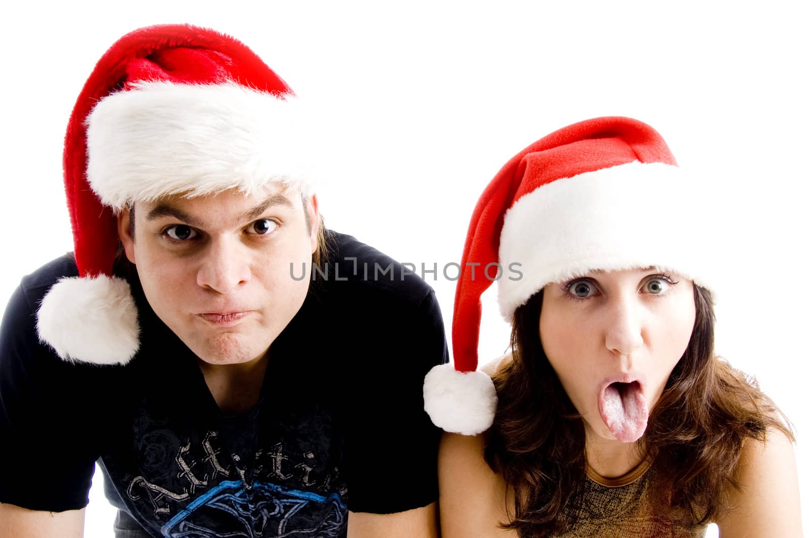 couple with christmas hat and making faces with white background