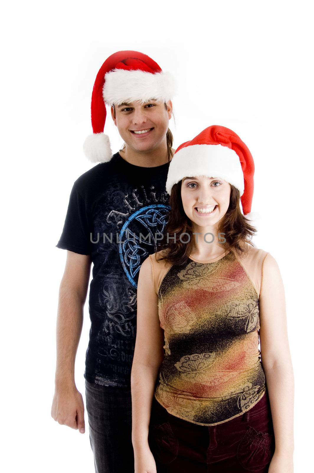 standing young couple wearing christmas hat against white background