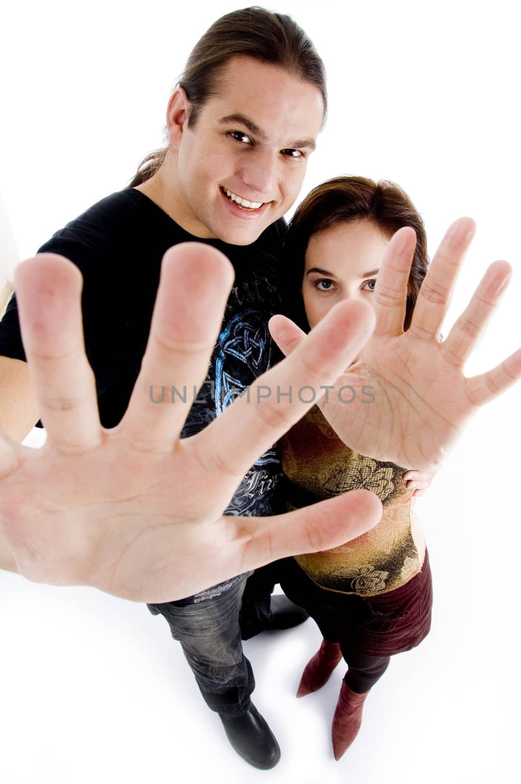 young couple showing their palms on an isolated white background