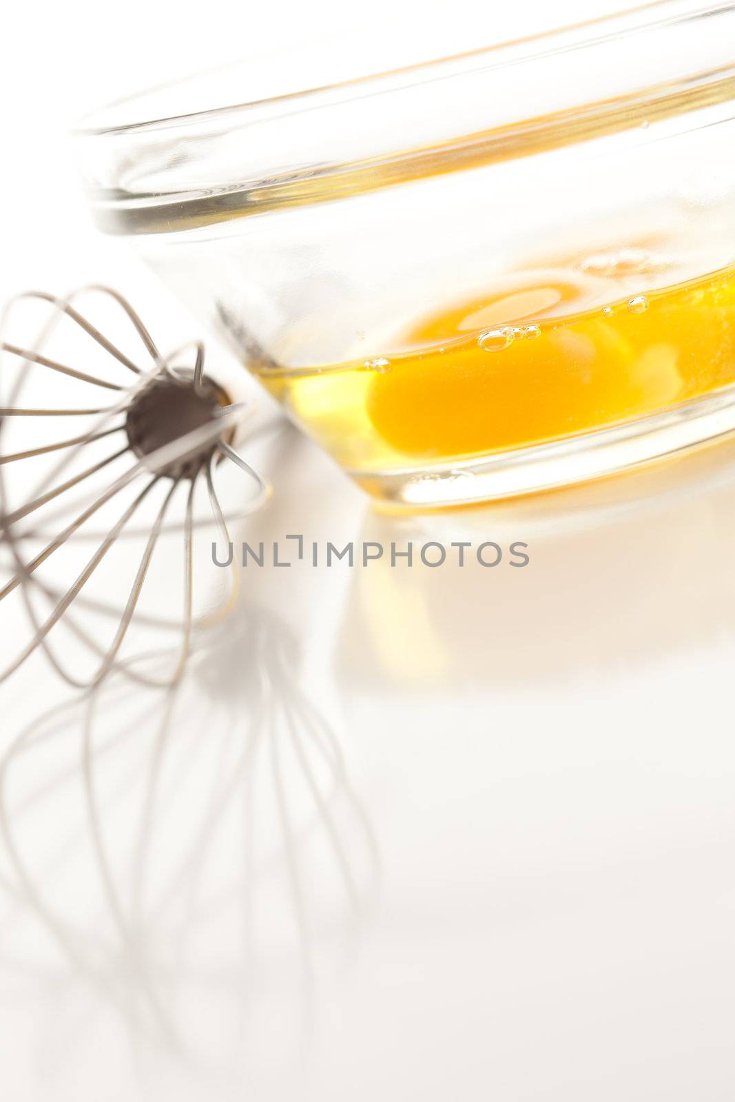 Hand Mixer with Eggs in Glass Bowl by Feverpitched