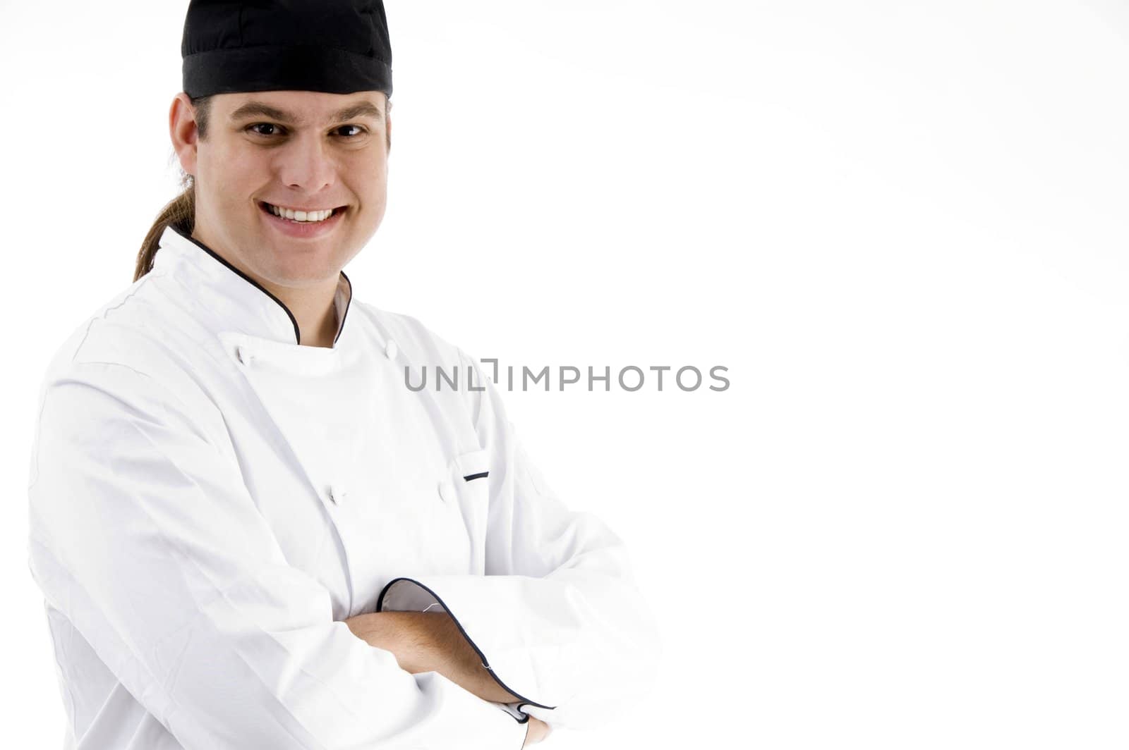 smiling young male chef on an isolated white background