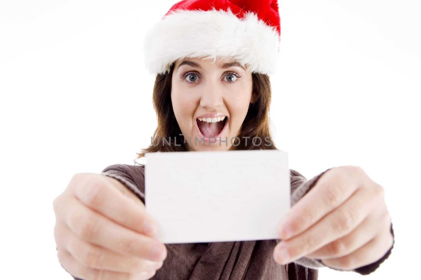 woman wearing christmas hat displaying business card by imagerymajestic