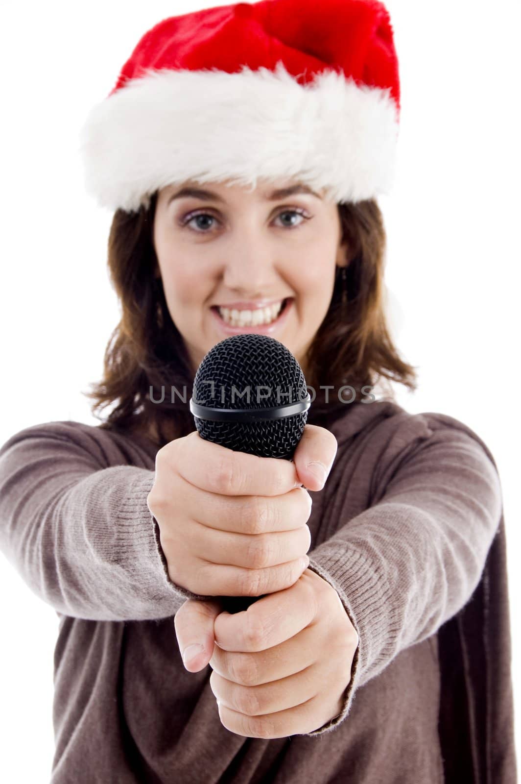 young female in christmas hat singing with white background