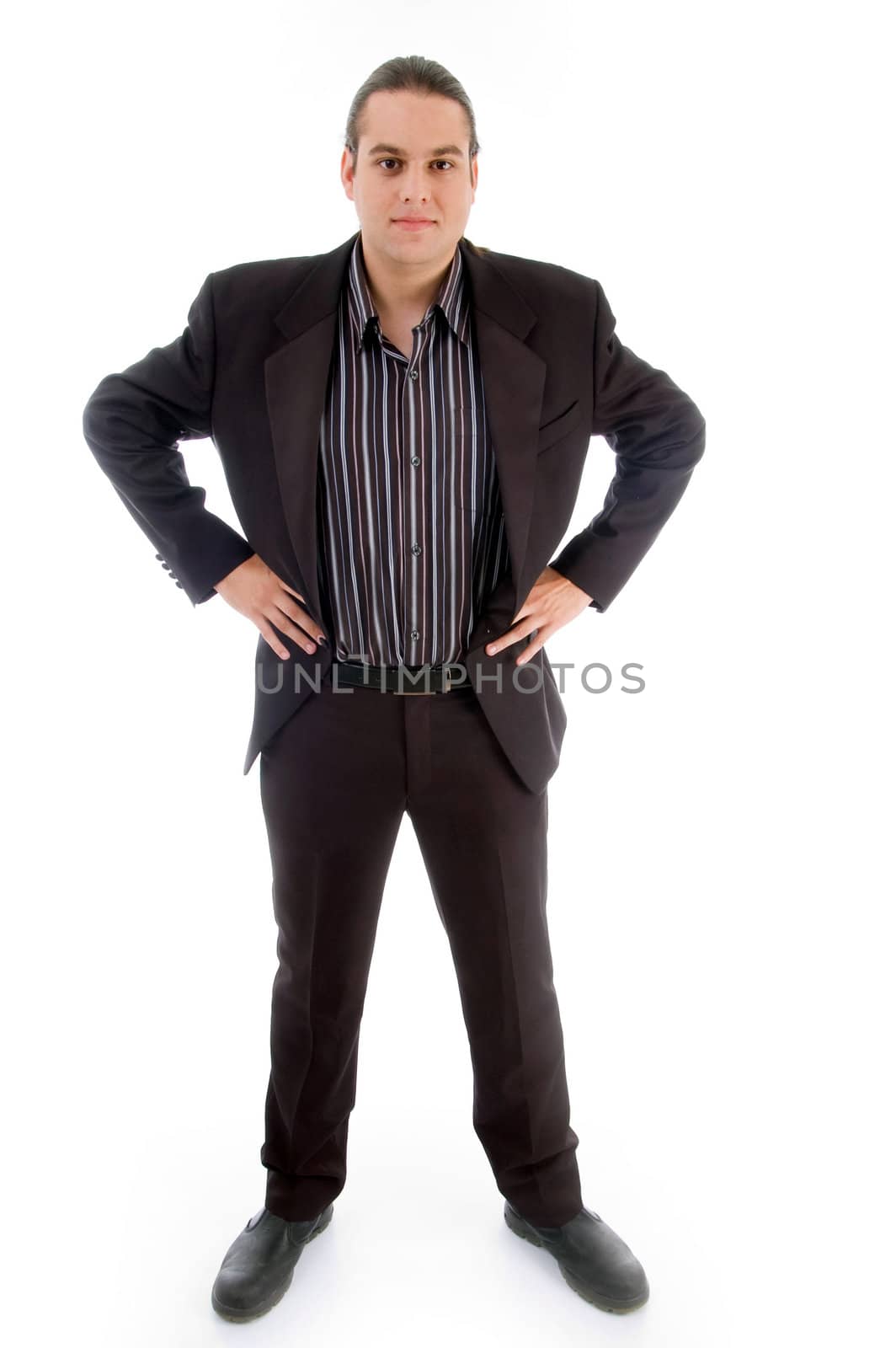 handsome corporate posing and looking at camera against white background